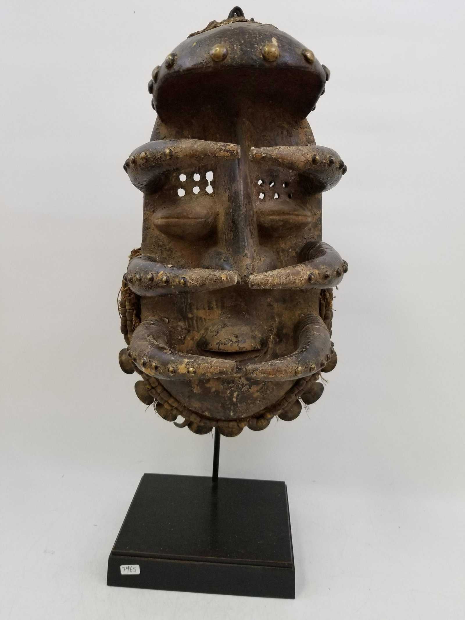 An Exceptional Rare Monumental African Wood Mask: An Antique Exceptional Rare Monumental African Wooden Mask with 9 Original Brass Bells and Metal Mounts. Please see the original paper description in the photos. In generally good condition. Dimension