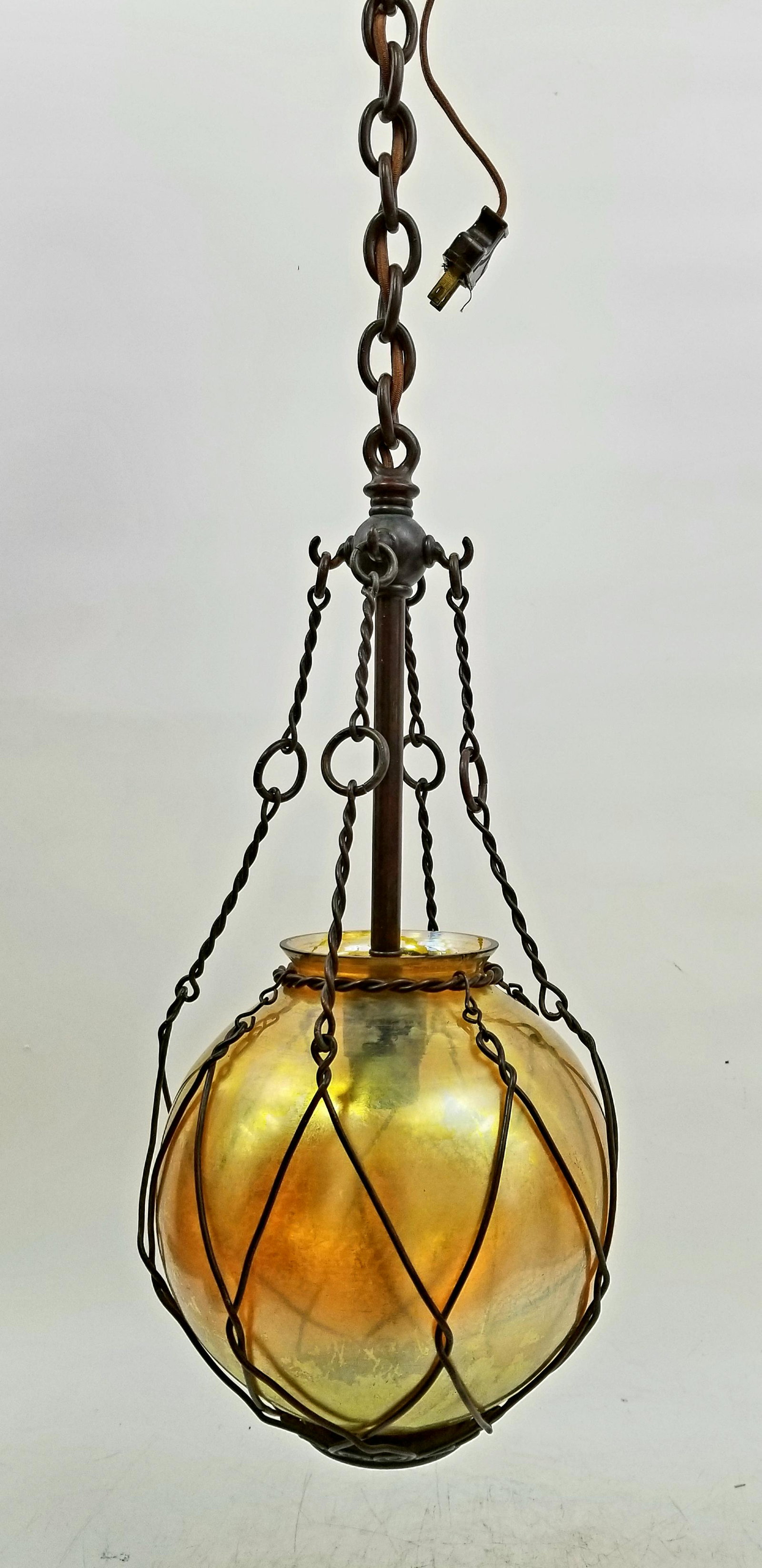 Tiffany Studios Bronze Moorish Chandelier: Tiffany Studios Bronze Moorish Chandelier with L.C.T Favrile Globe Shade. Generally very good condition with couple of minor chips on the rim of the shade. Dimensions: Dia of the shade 7.5", Total H 3