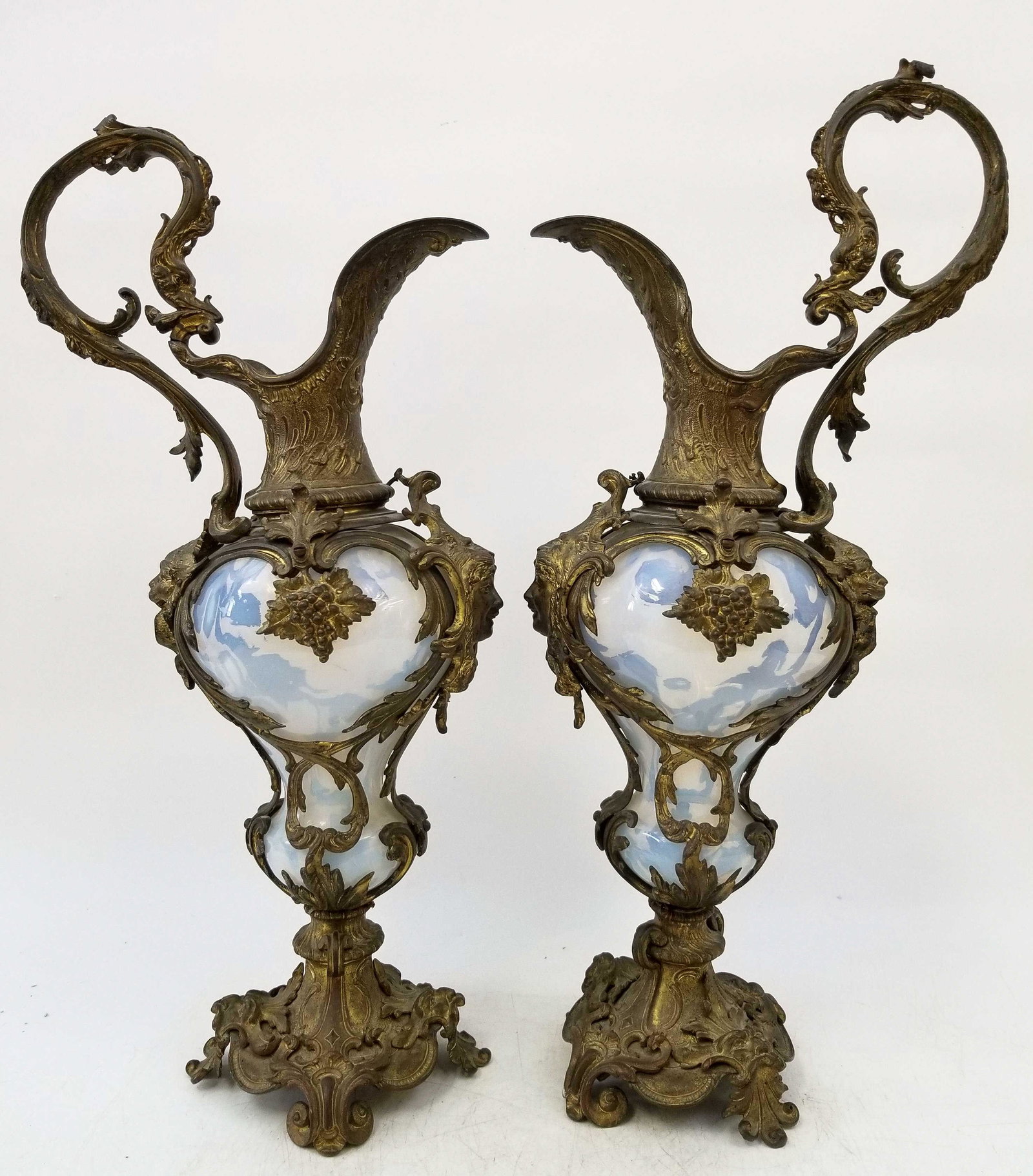 Large Pair of Opaline Glass Bronze Mounted Ewers: Large Pair of Opaline Glass Bronze Mounted Ewers. Late 19thC or Early 20thC. Both are in generally very good condition, Bronzes are slightly loose. Dimensions: H 19" Provenance: From a Long Island Est