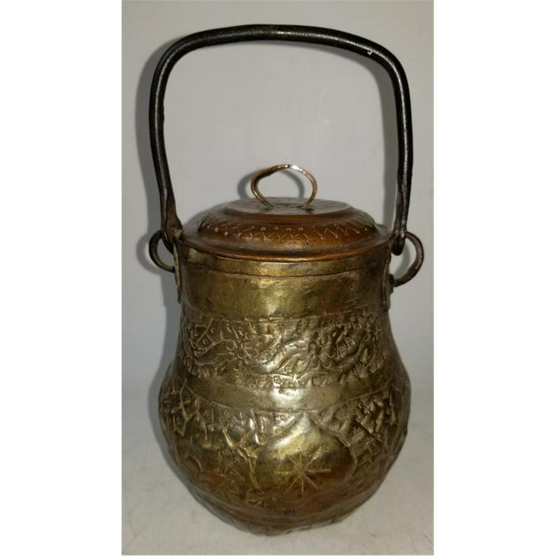 Antique Middle Eastern Islamic Brass Covered Pot: Antique Middle Eastern Islamic Brass Covered Small Pot with Metal Handle. Condition: As found with some dents due to age.Dimensions: Total w/ Handle H-9 ". Provenance: From a Long Island, NY Estate. P