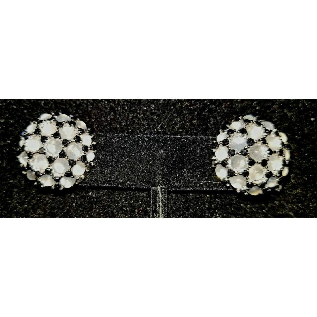 18K White Gold, Black Diamond & Moonstone Earrings: Pair of 18K White Gold, Black Diamond & Moonstone Earrings. There are 2.3 Carats of Black Diamonds & 9 Carats of Moonstone Cabochons. Condition: Excellent.Dimensions: Dia- .75".Total Weight: 15.7g./10