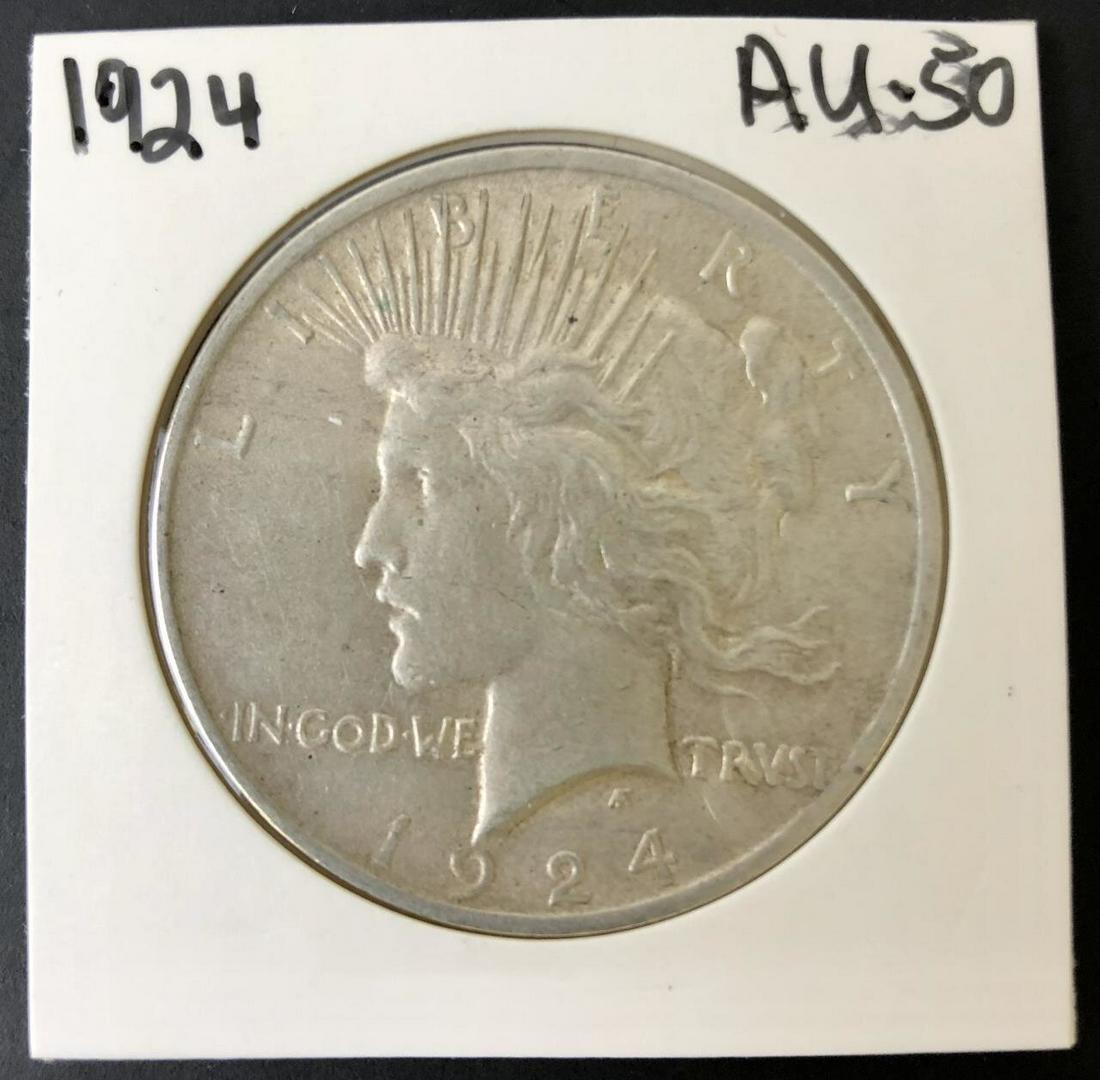 1924 Peace Silver Dollar AU.: 1924 Peace Silver Dollar AU 50.Provenance: From a Long Island, NY Collector. Please note the absence of a condition report does not imply that there are no condition issues with this lot. Please conta