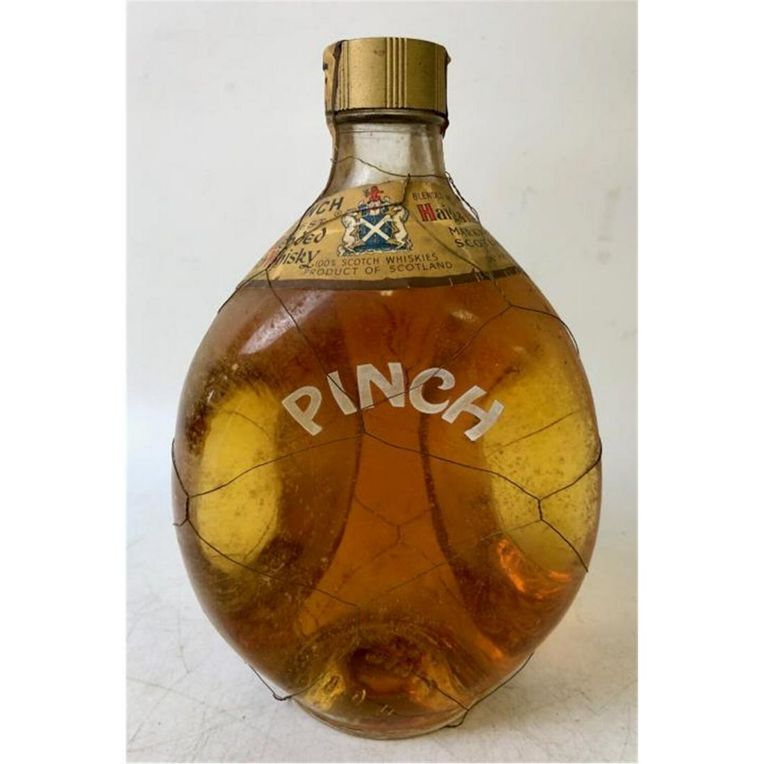1950's Unopened Pinch by Haig & Haig Whiskey: 1950's Unopened Pinch by Haig & Haig Whiskey.Provenance: From a Long Island, NY Home. Please note the absence of a condition report does not imply that there are no condition issues with this lot. Ple
