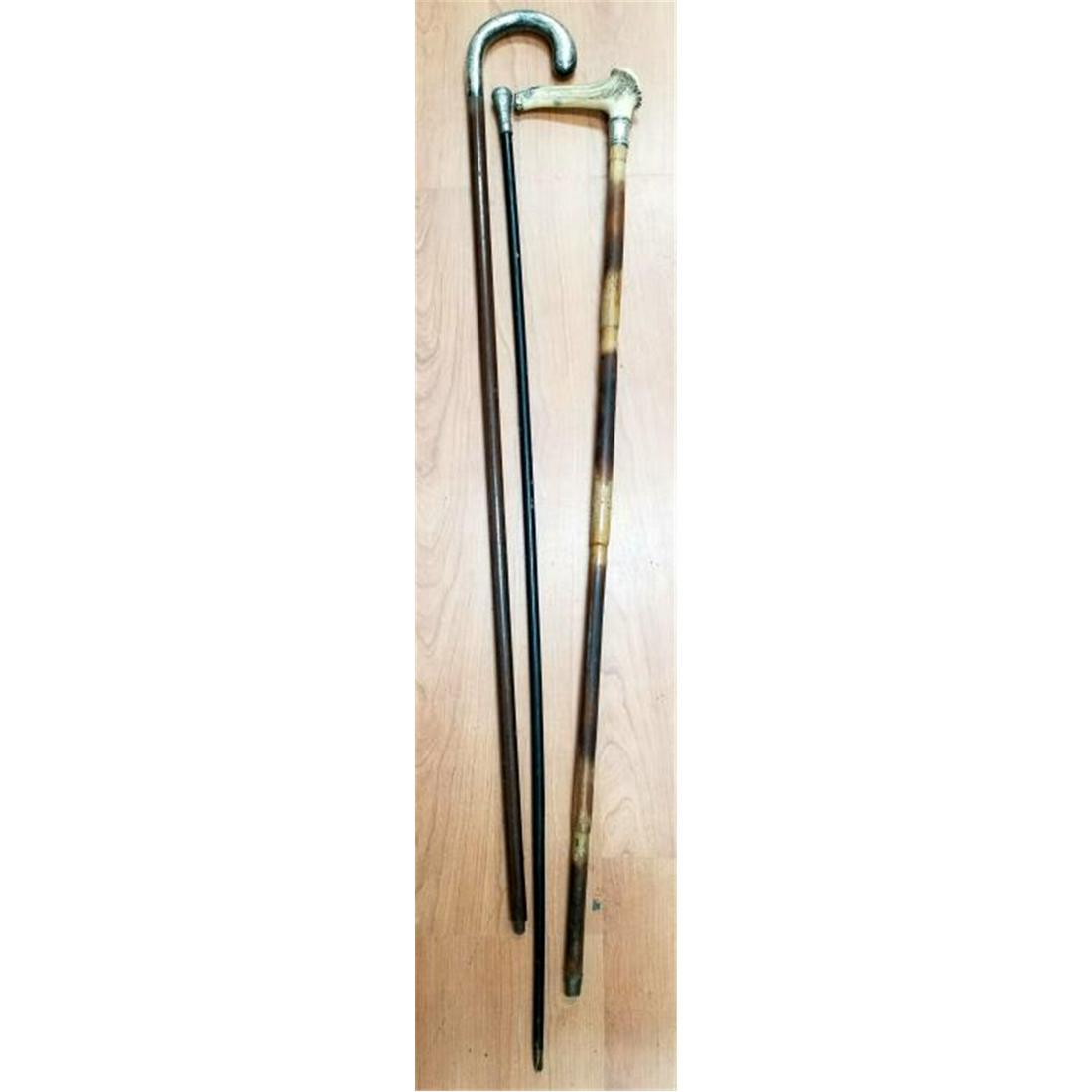 Lot of 3 Vintage Walking Sticks 1 with Deer Antler: Lot of 3 Vintage Walking Sticks. 1 with Deer Antler Handle. Condition: Generally Good. As Found. Dimensions: Longest- L-39". Provenance: From a Long Island, NY Collector. Please note the absence of a 