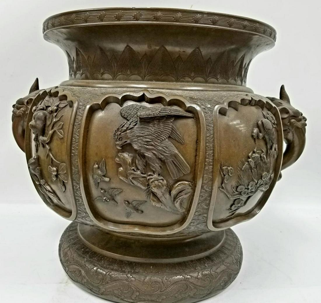 Large Signed Chinese or Japanese Antique Bronze.: Large Signed Chinese or Japanese Antique 2 Handle Bronze Planter/Vase with 3 Dimensional Decorations of Birds, Monkey's & Other Animals. Condition: Generally Good Condition. Dimensions: Dia-20" x H-16