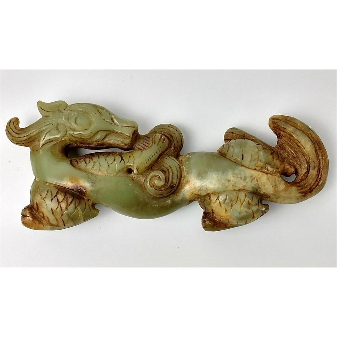 Chinese Green Carved Hard Stone Figure of a Dragon: Chinese Green Carved Hard Stone Figure of a Dragon.Condition: Generally Good. Dimensions: L-7". Provenance: From a Long Island, NY Home. Please note the absence of a condition report does not imply th