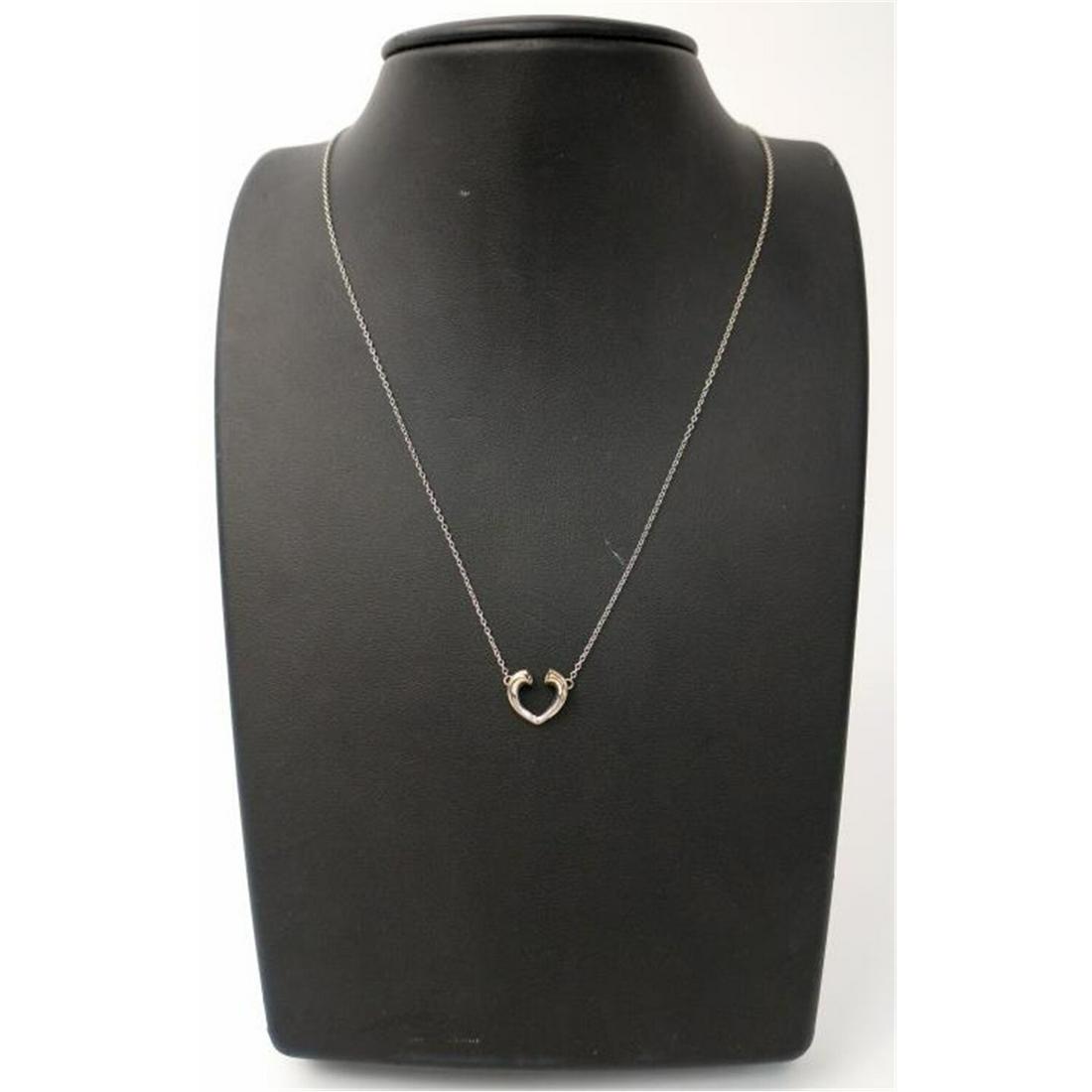 Tiffany & Co Paloma Picasso 18K White Gold Pendant: Tiffany & Co. 18K White Gold & Diamond Pendant & Chain by Paloma Picasso. In Original Tiffany Pouch.Condition: Excellent. Dimensions: L- 17". Total Weight- 2.5g./1.6dwt. Provenance: From a Long Island