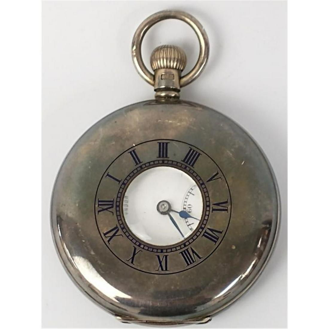 J.W. Benson, London Sterling Silver Pocket Watch: J.W. Benson, London Sterling Silver Pocket Watch. Swiss Made. Fully Hallmarked. Comes w/ Original Leather Pouch.Condition: Appears to be in Very Good Condition. Dimensions: Dia-2". Provenance: From a 
