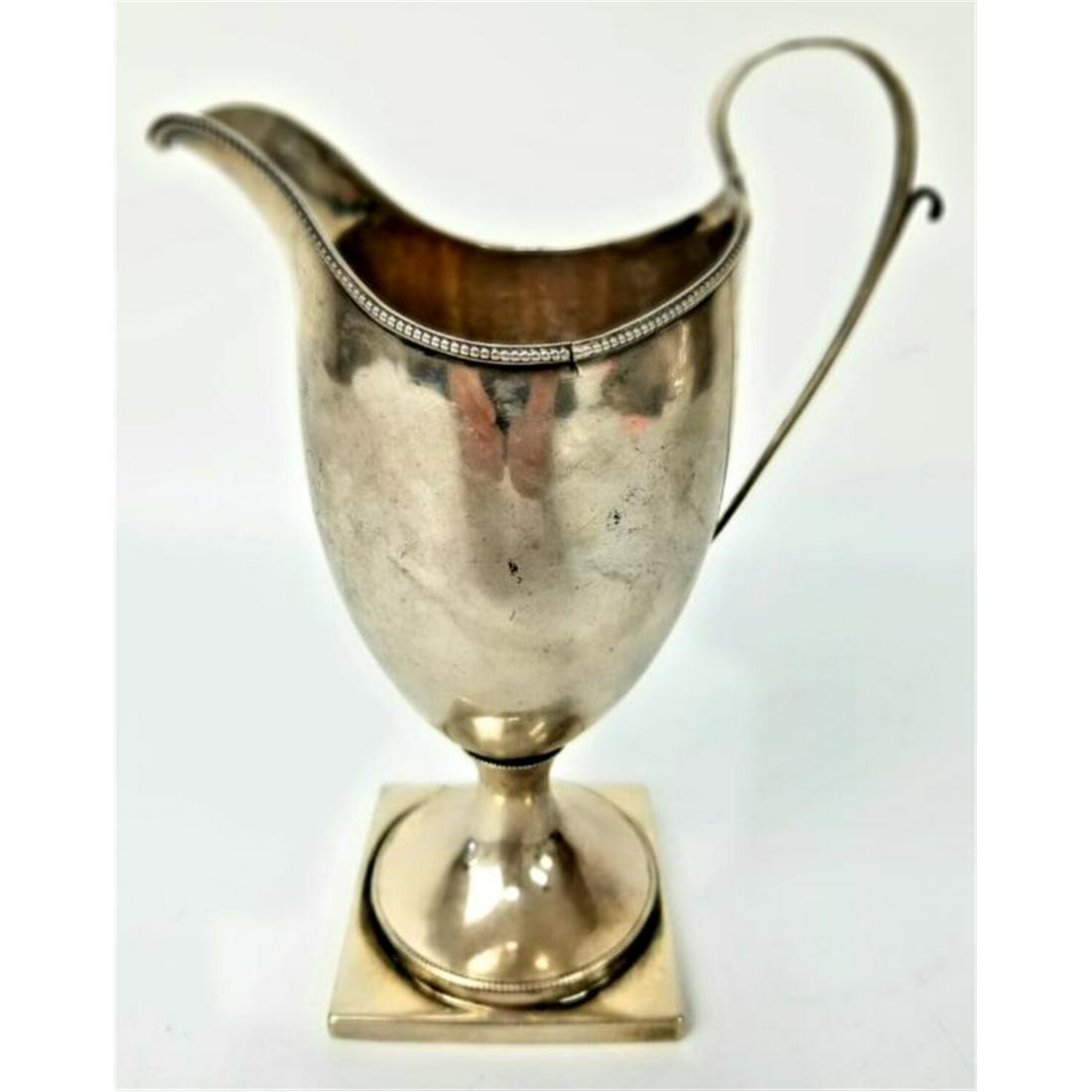 American Coin Silver Milk Pitcher by Robert Swan: American Coin Silver Milk Pitcher by Robert Swan, Philadelphia, PA c.1790. Monogrammed. Fully Hallmarked.Condition: Generally Good Condition. There are a couple of minor tears on the edge. Dimensions:
