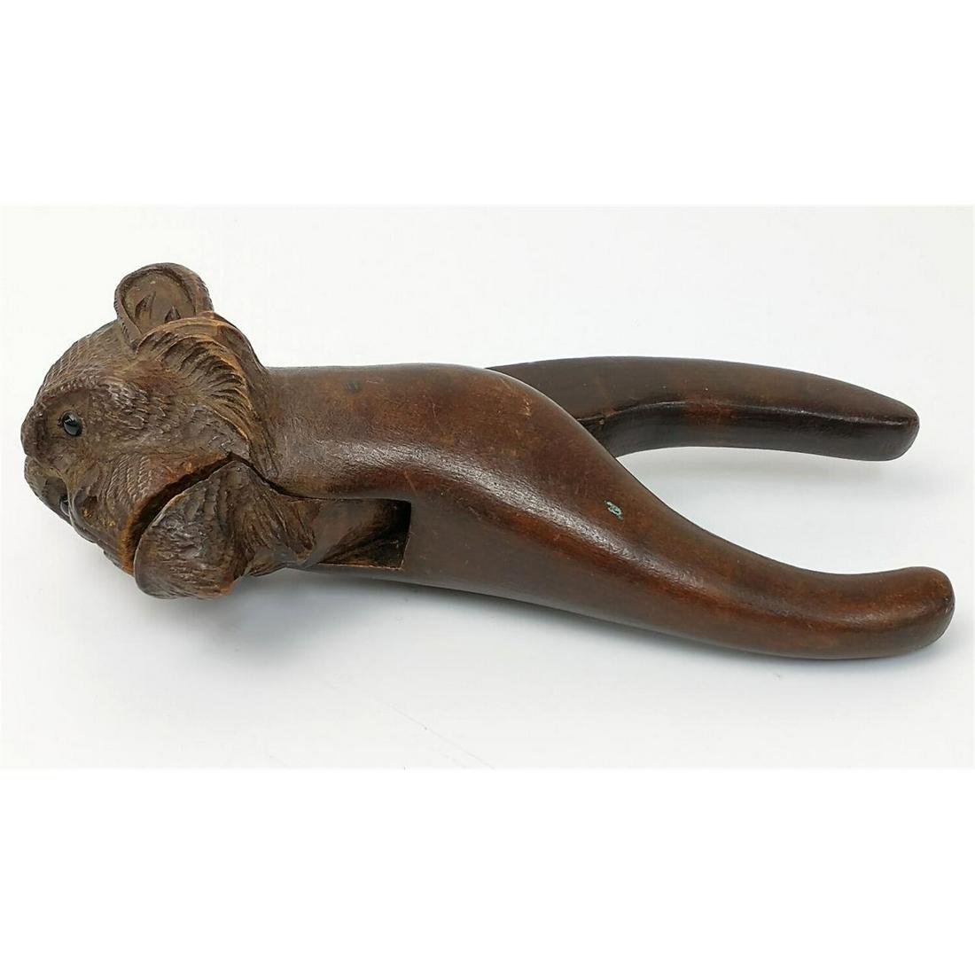 Antique Rare Carved Wood Monkey Nut Cracker.: Antique Rare Carved Wood Monkey Nut Cracker (Probably Black Forest), with Glass Eyes. Condition: Generally Good Condition. Dimensions: L-6.25" x W-2.5". Provenance: From a Long Island, NY Home. Please