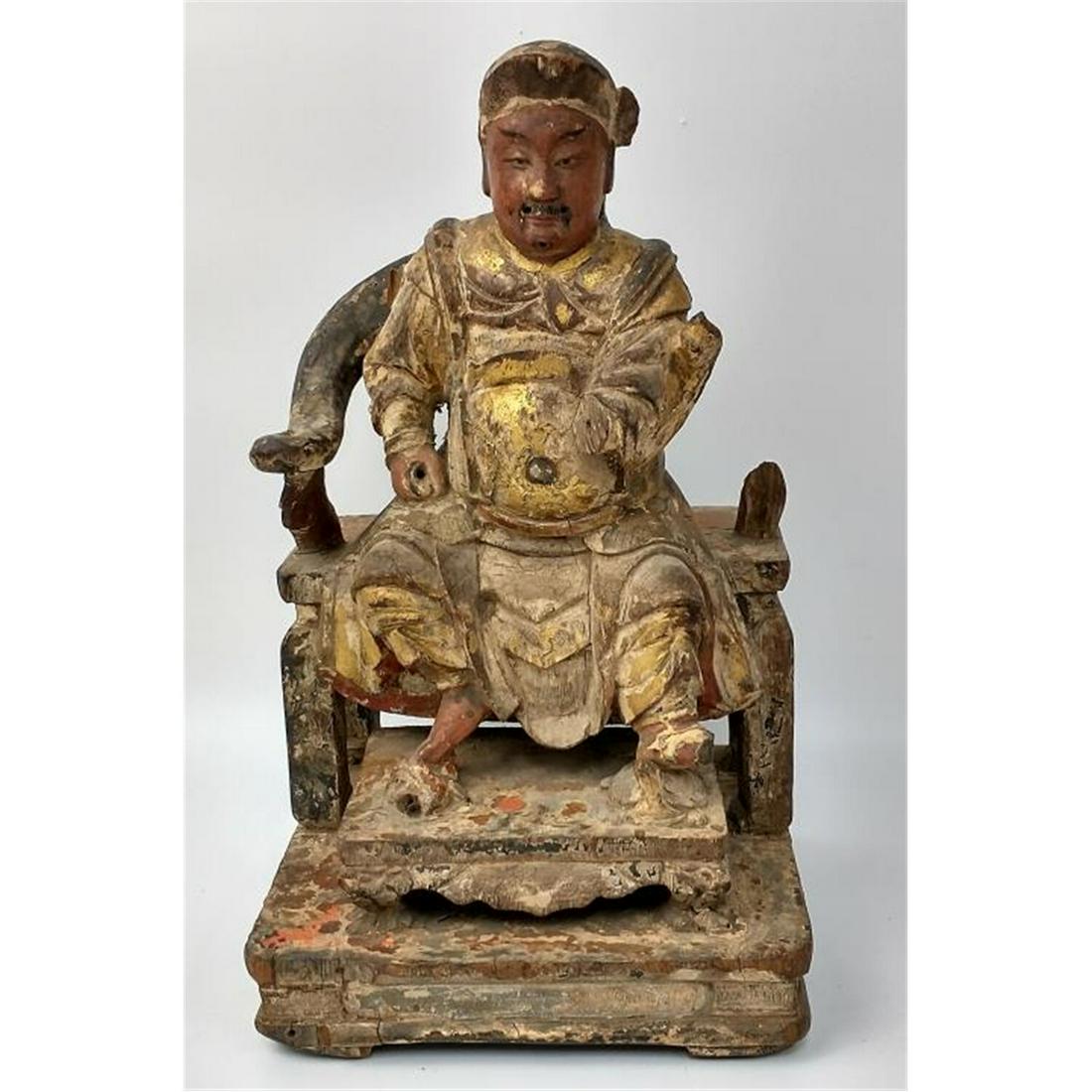 Chinese Antique Carved Wood Seated Figure.: Chinese Antique Carved Wood Seated Figure. Condition: As found. Dimensions: H-11" x L-6.5" x W-6.5". Provenance: From a Long Island NY, Estate. Please note the absence of a condition report does not i