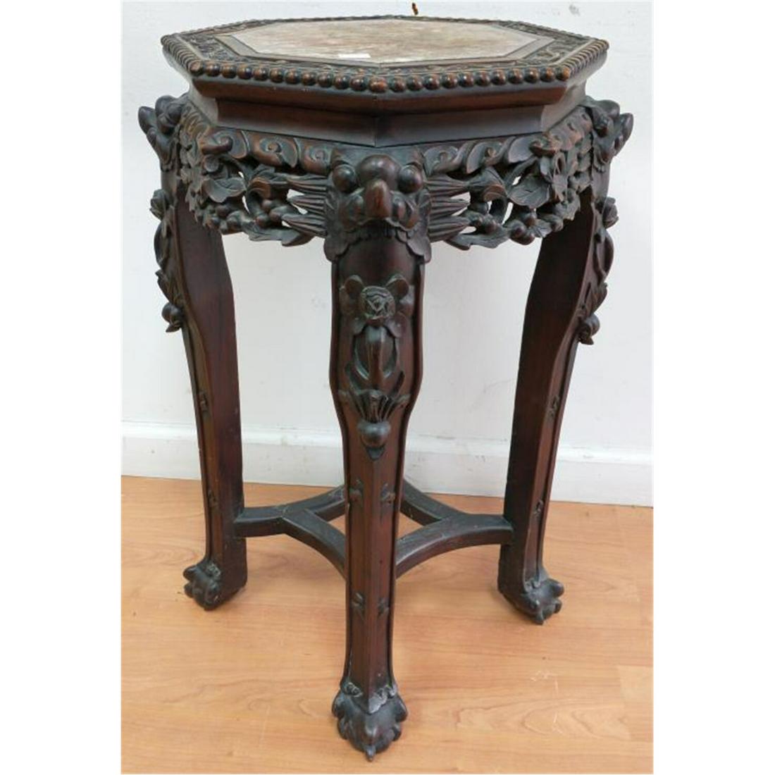 Chinese Antique Teak Wood 4 Leg Side Table.: Chinese Antique Teak Wood 4 Leg Side Table with Marble Top.Condition: Generally Good Condition. Minor Loss on 1 Leg. Dimensions: H-24" x Dia-14". Provenance: From a Queens, NY Home. Please note the ab