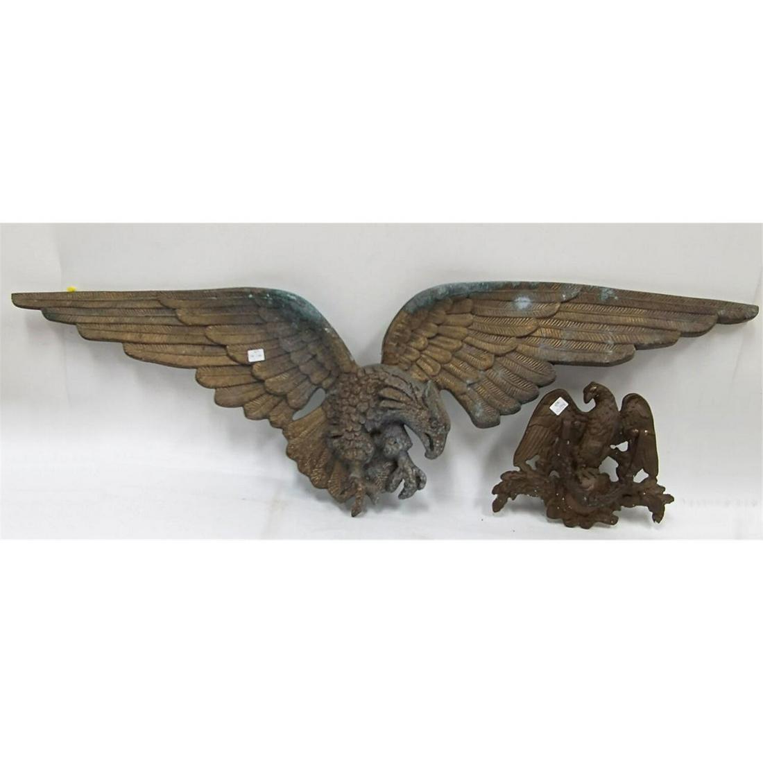 Vintage Eagle Bronze Door Knocker, & 1 Other.: Vintage Eagle Bronze Door Knocker. Along with a Large Brass Eagle Wall Hanging. Condition: Door knocker is in Generally Good Condition. Wall Hanging has a lot of oxidation. Dimensions: Wall Hanging- L