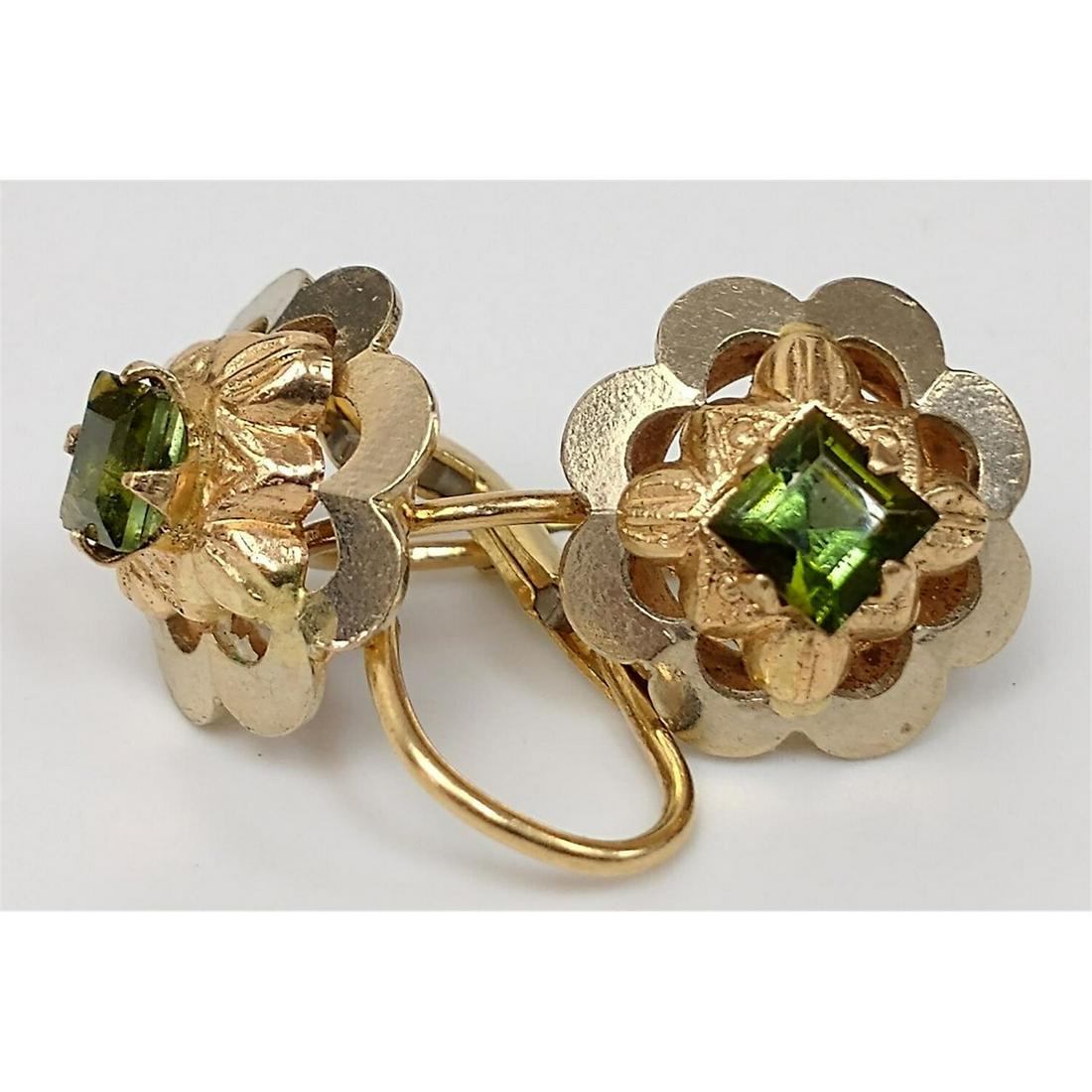 Pair of 14k White & Yellow Gold Peridot Earrings.: Pair of 14k White & Yellow Gold Peridot Earrings with Peridot Centers. Condition: Excellent Condition. Total Weight: 3.2g./2dwt. Provenance: From a Long Island, NY Home. Please note the absence of a c