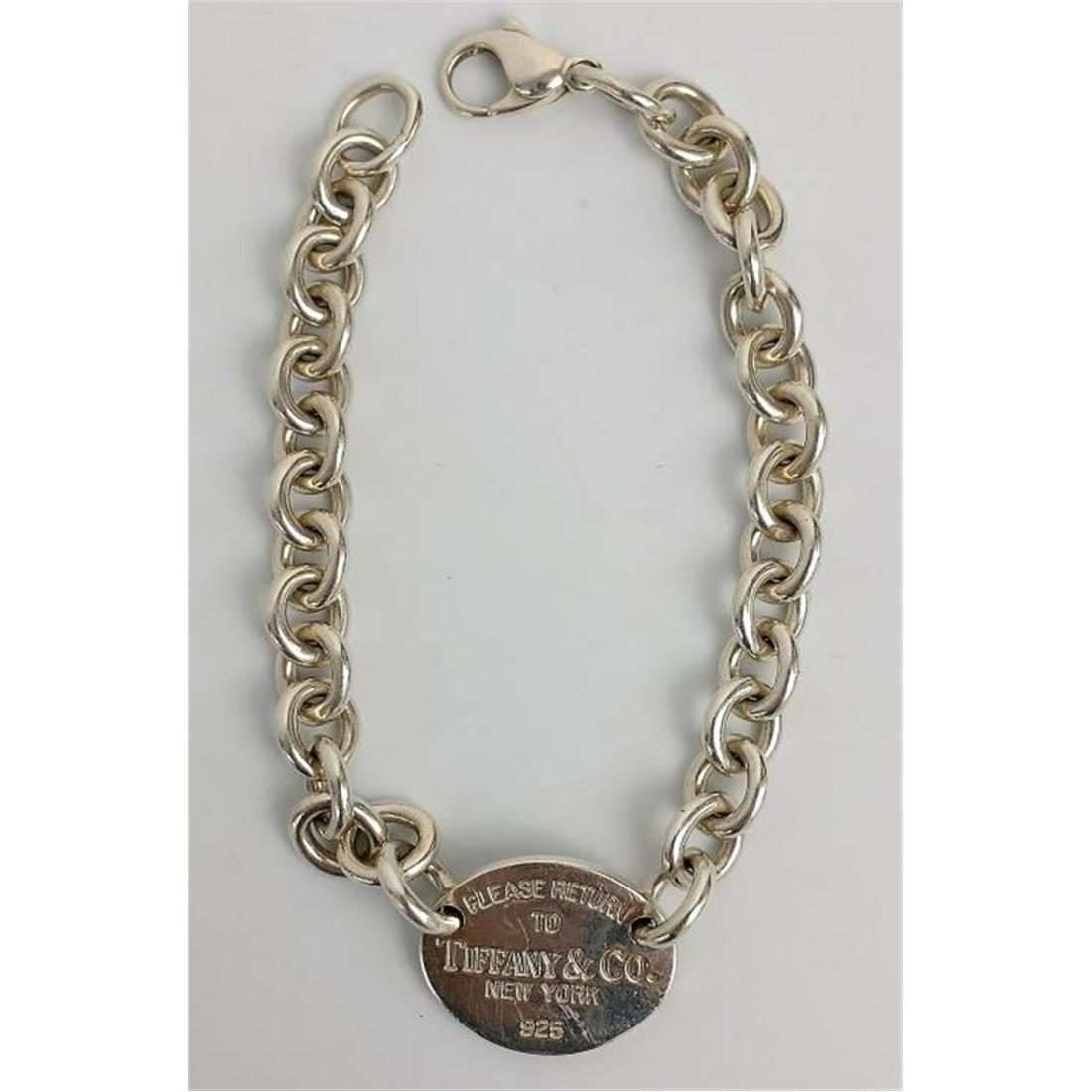 Tiffany & Co. Sterling Silver Bracelet, Oval: Tiffany & Co. Sterling Silver Bracelet, "Please Return To", Oval Shape. Condition: Generally Good Condition. Dimensions: L-7.5". Total Weight: 28g./.9ozt. Provenance: From a Long Island, NY Home. Plea
