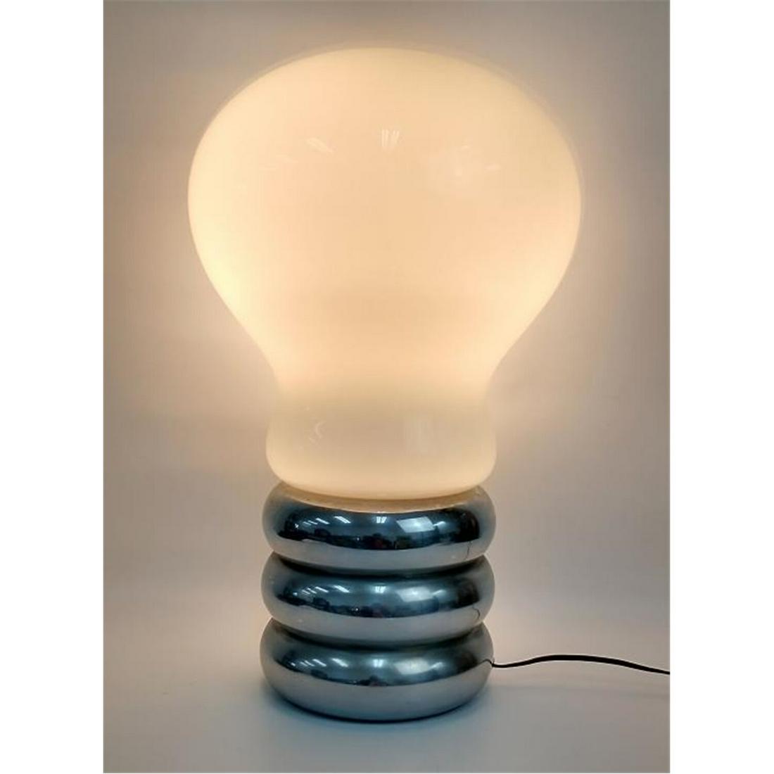 'Giant Bulb" Table Lamp By Ingo Maurer: "Giant Bulb" Table Lamp By Ingo Maurer, German (1932-2019). Made for Design M, Germany, Circa 1967. Glass & Chromed Metal.Condition: Generally Good Condition.Dimensions: H-21", Dia-13".Provenance: Fro