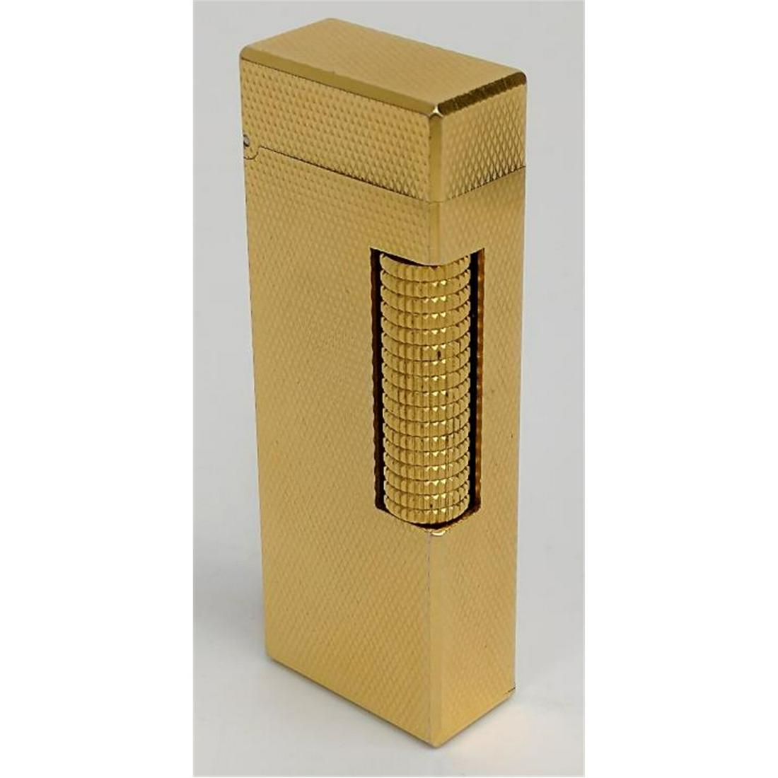 Dunhill Lighter, Made in Switzerland: Dunhill Lighter, Made in Switzerland. Condition: Generally Good Condition. Dimensions: H-2.5". Provenance: From a North Shore Long Island, NY Estate. Please note the absence of a condition report does