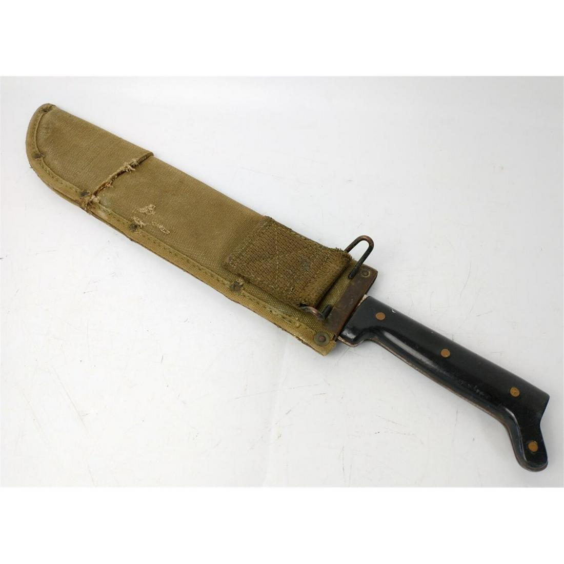 WWII Garza Short Machete w/ Scabbard.: WWII Garza Short Machete w/ Scabbard. Condition: As FoundDimensions: L-18"Provenance: From a New York City Estate.Please note the absence of a condition report does not imply that there are no conditi