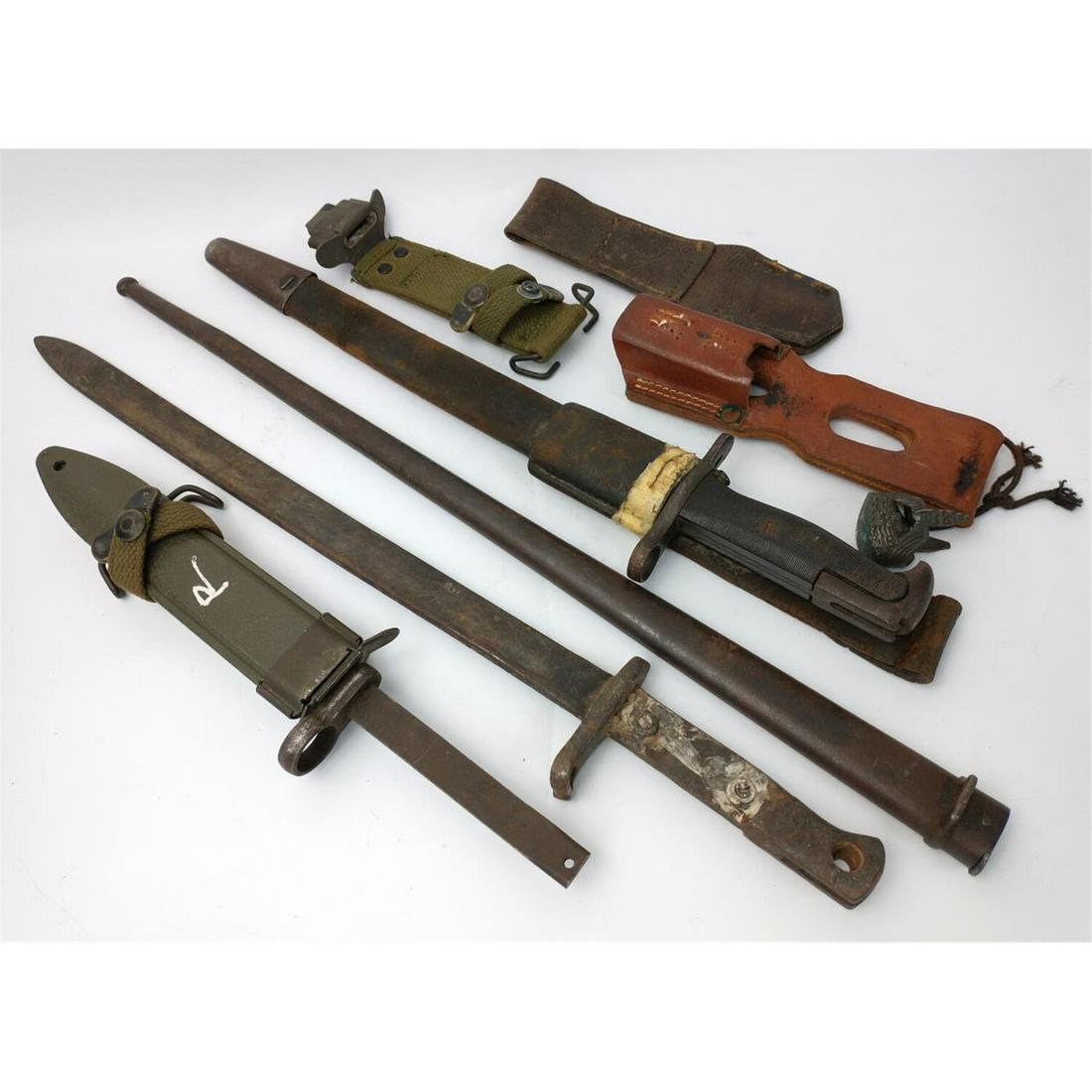 Antique Rifle Bayonet, Scabbard & Frog Lot.: Antique Rifle Bayonet, Scabbard & Frog Lot. Includes 3 Bayonets, 3 Scabbards, 3 Frogs &1 Japanese Katana Fitting. 10 Items Total. Condition: As FoundDimensions: Longest Bayonet- L-20".Provenance: From