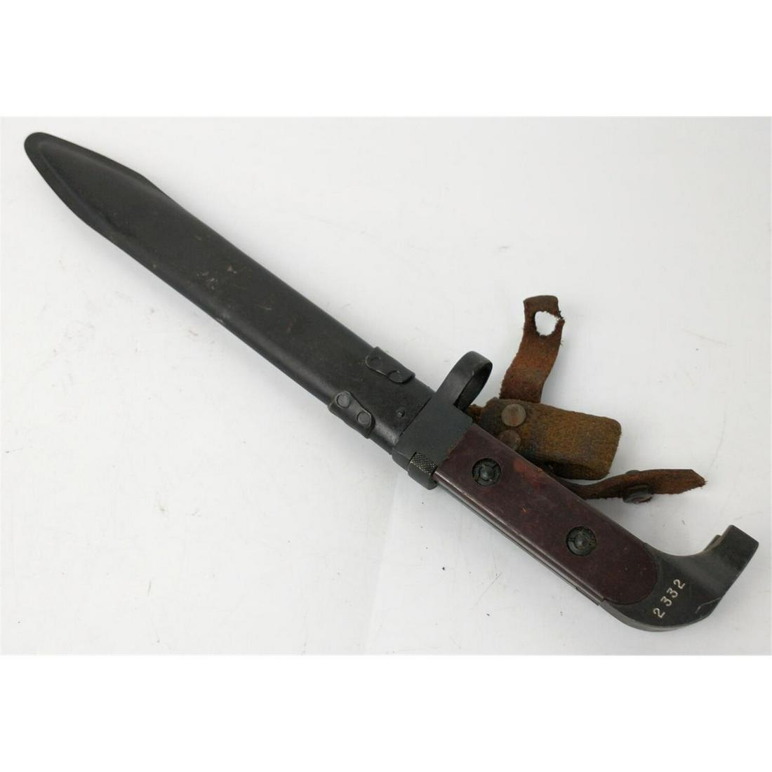 Vintage Rifle Bayonet w/ Scabbard.: Vintage Rifle Bayonet w/ Scabbard. Possibly European. Condition: As FoundDimensions: L-13"Provenance: From a New York City Estate.Please note the absence of a condition report does not imply that ther
