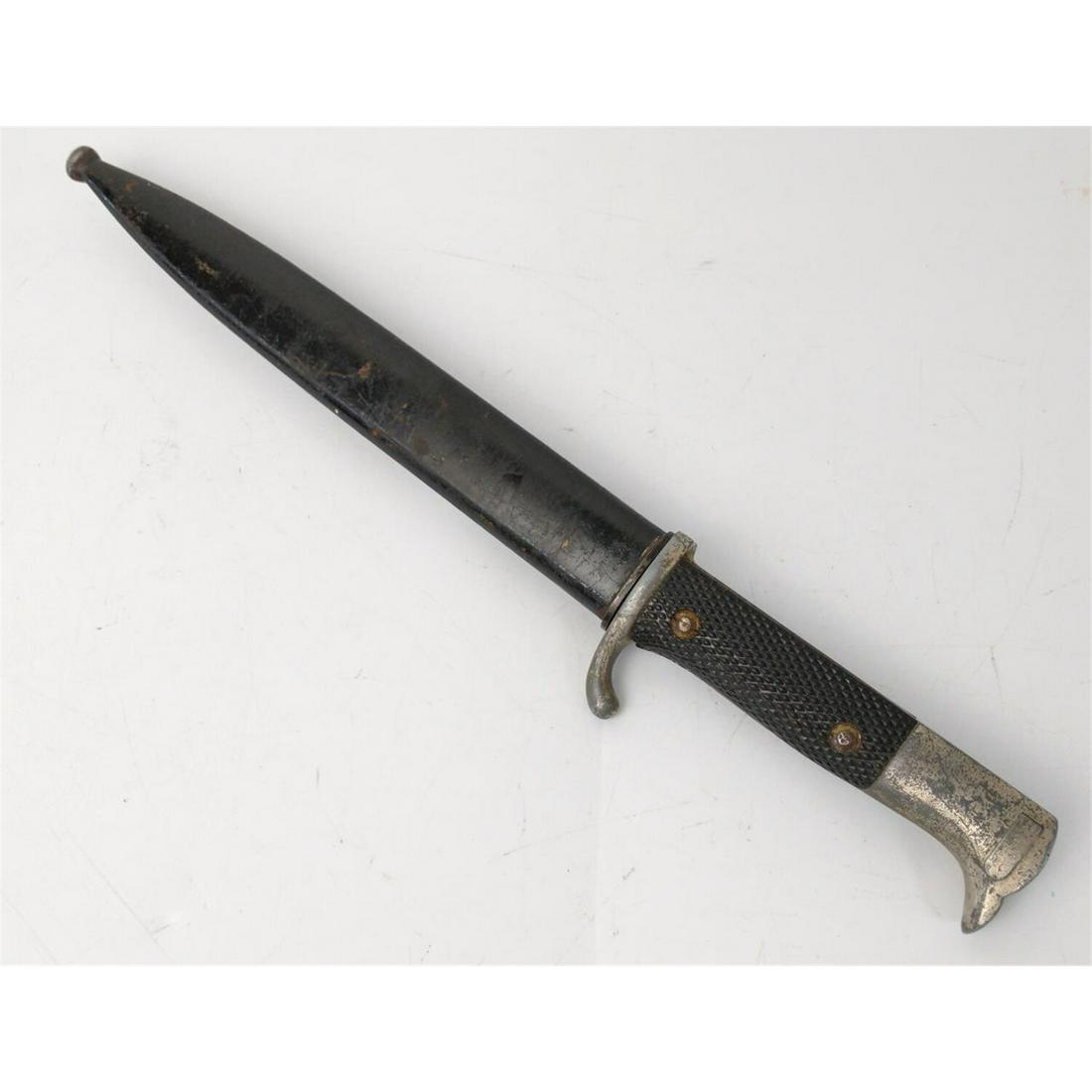 WWII German Rifle Bayonet w/ Scabbard.: WWII German Rifle Bayonet w/ Scabbard. Condition: As FoundDimensions: L-13.5"Provenance: From a New York City Estate.Please note the absence of a condition report does not imply that there are no cond