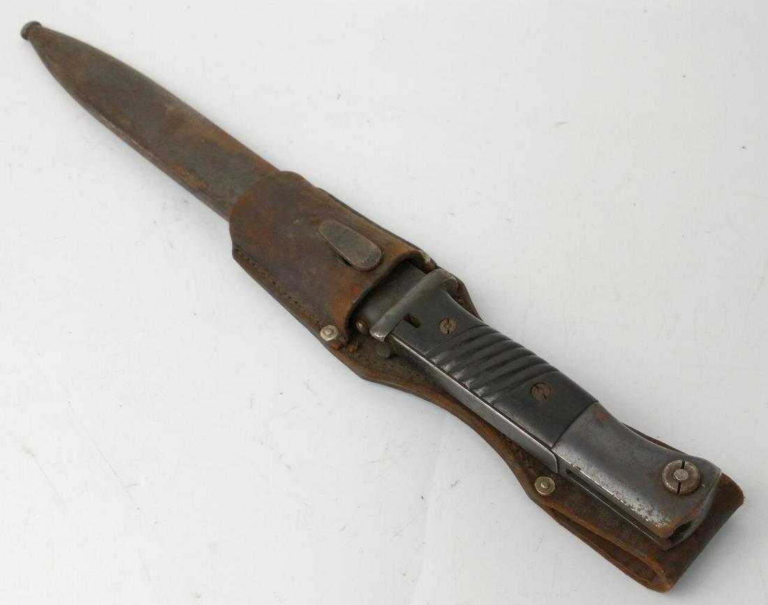 WWII K98 Rifle Bayonet w/ Scabbard & Leather Frog: WWII K98 Rifle Bayonet w/ Scabbard & Leather Frog. F. Herdera. Matching Numbers 252 C.Condition: As FoundDimensions: L-16".Provenance: From a New York City Estate. Please note the absence of a conditi
