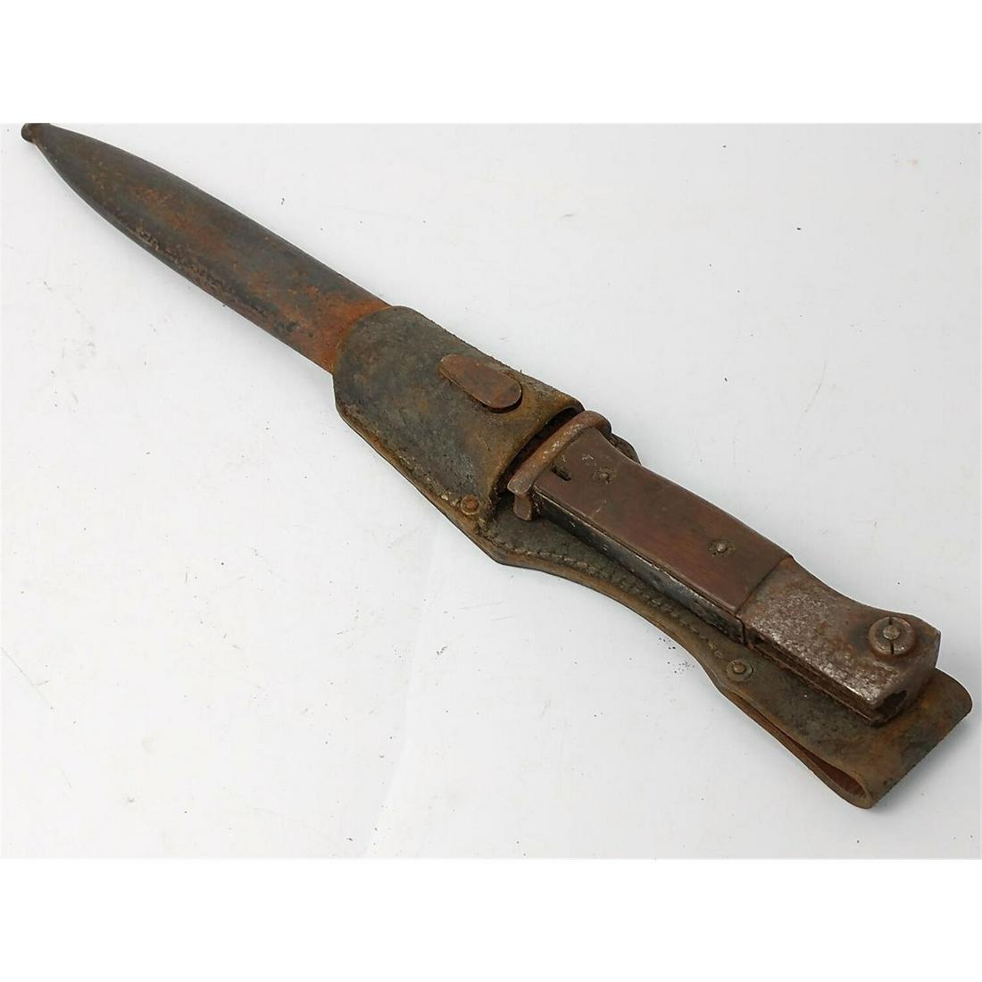 WWII K98 Rifle Bayonet w/ Scabbard & Frog. Mundlos: WWII K98 Rifle Bayonet w/ Scabbard & Frog. Mundlos. Condition: As FoundDimensions: L-16". Provenance: From a New York City Estate. Please note the absence of a condition report does not imply that the