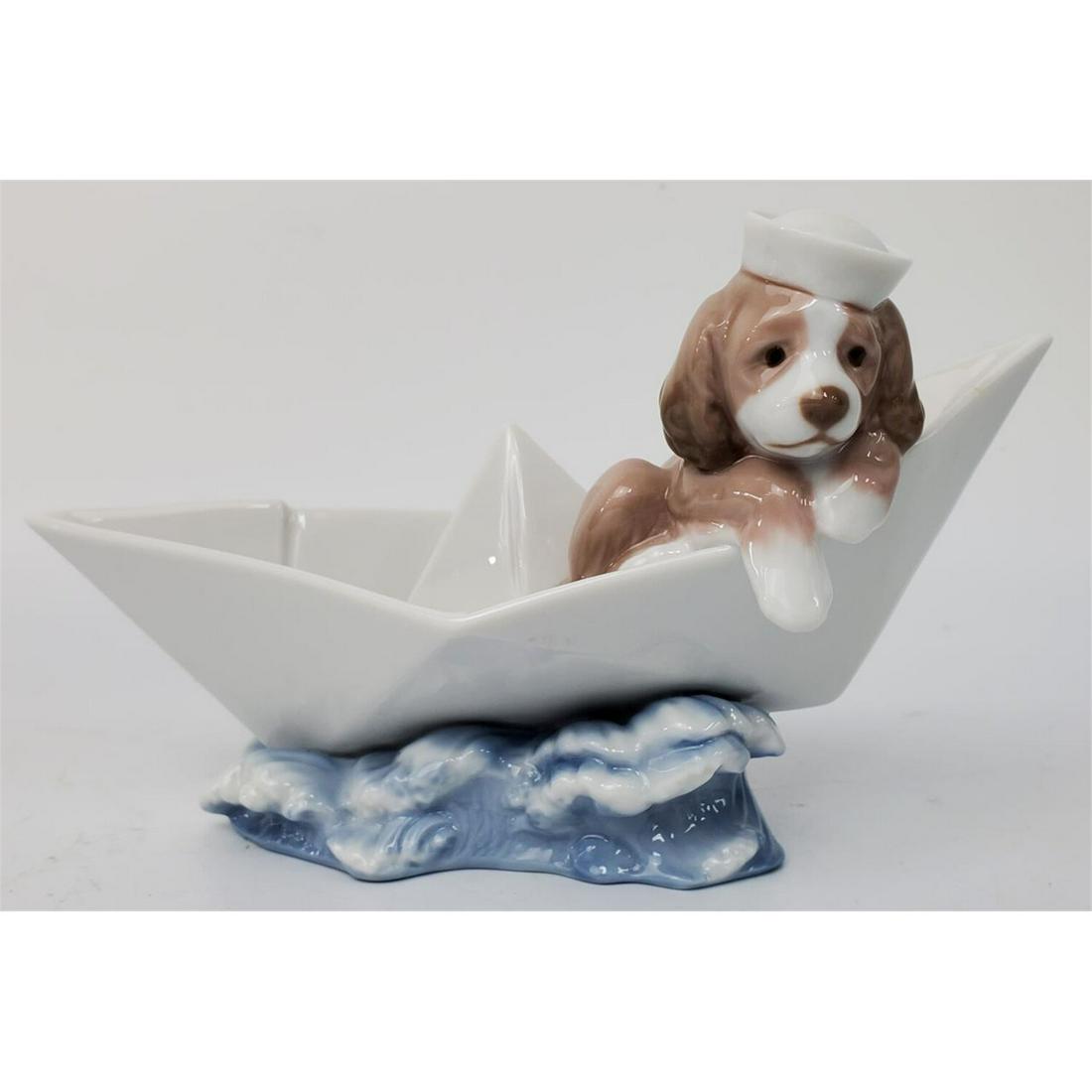 Lladro Figurine #6642 "Little Stowaway": Lladro Figurine #6642 "Little Stowaway" Circa 2000 With Original Box Condition: Generally Very Good ConditionDimensions:L-7"Provenance: From a Long Island NY Collection.Please note the absence of a co
