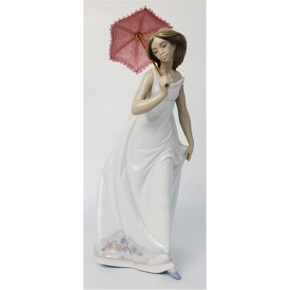 Lladro Figurine #7636 "Afternoon Promenade": Lladro Figurine #7636 "Afternoon Promenade" Circa 1995 With Original BoxCondition: Generally Very Good ConditionDimensions: H-10.5"Provenance: From a Long Island NY Collection.Please note the absence 
