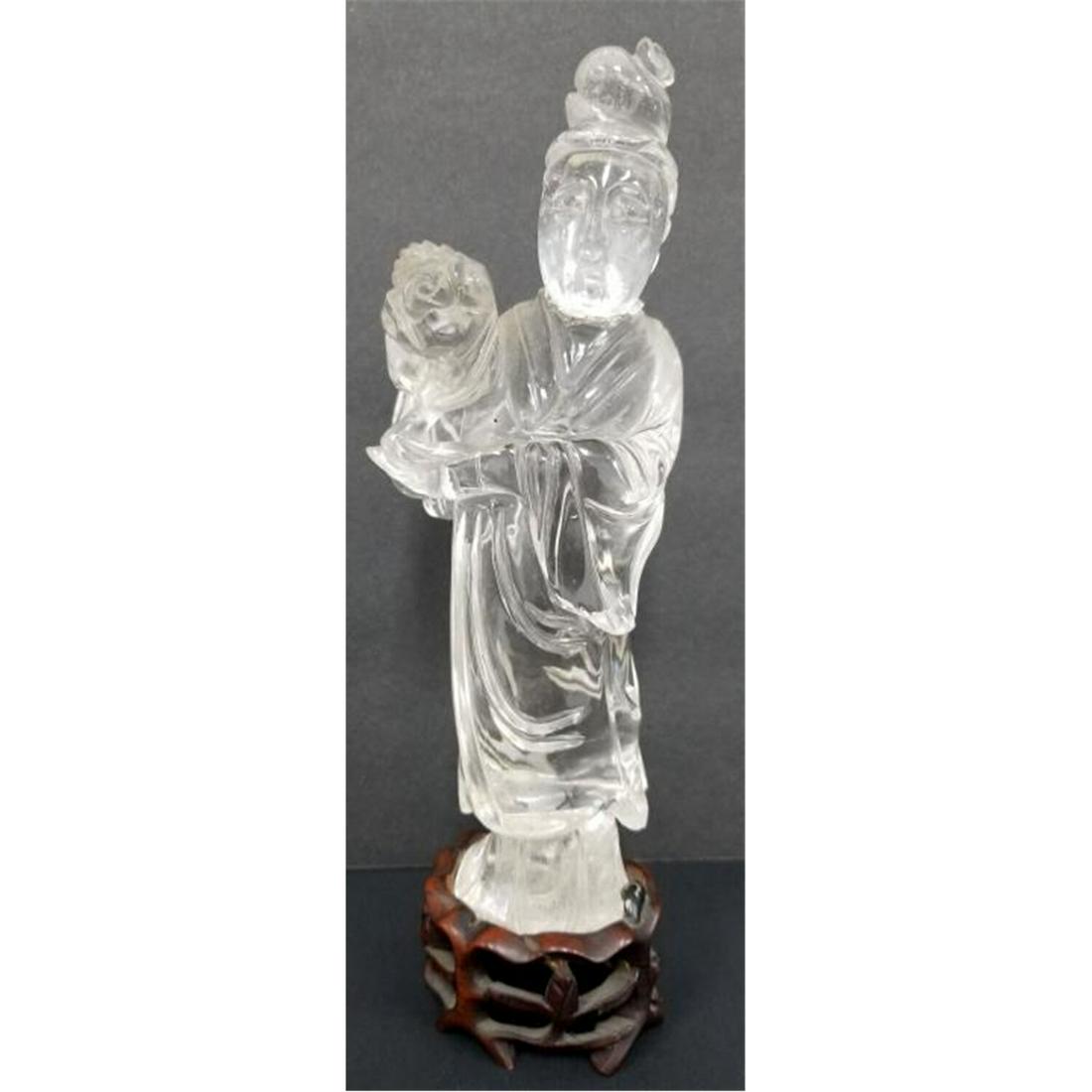 Antique Chinese Rock Crystal Figure of Deity: Antique Chinese Rock Crystal Figure of Deity on Original Carved Wood Base. Condition: Head Detached and Glued Back. Dimensions: Figure H: 7.5". Provenance: Lifetime Collection of an Important Retired 