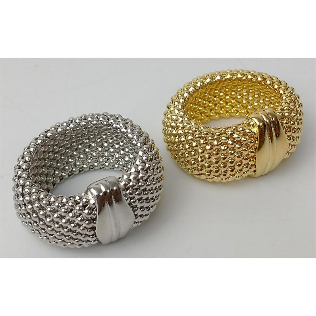 2 Sterling Silver Mesh Rings: 2 Sterling Silver Mesh Rings. 1 is Gold Gilt. Made in Italy. Numbered & Hallmarked. Condition: Excellent Condition. Dimensions: Ring Size- 7. Total Weight: 15.1g./.49ozt. Provenance: From a North Shor