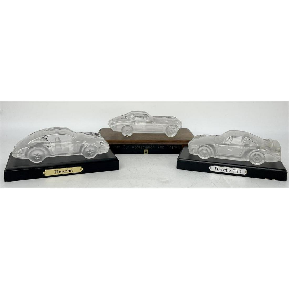 Lot of 3 Vintage Art Glass Cars (Possibly Daum): Lot of 3 Vintage Art Glass Cars (Possibly Daum). Including Porsche and Corvette. On Wood Stands with Plaques. One Award from General Motors. Condition: Very Good. Dimensions: Largest Car L: 6.75" x W: