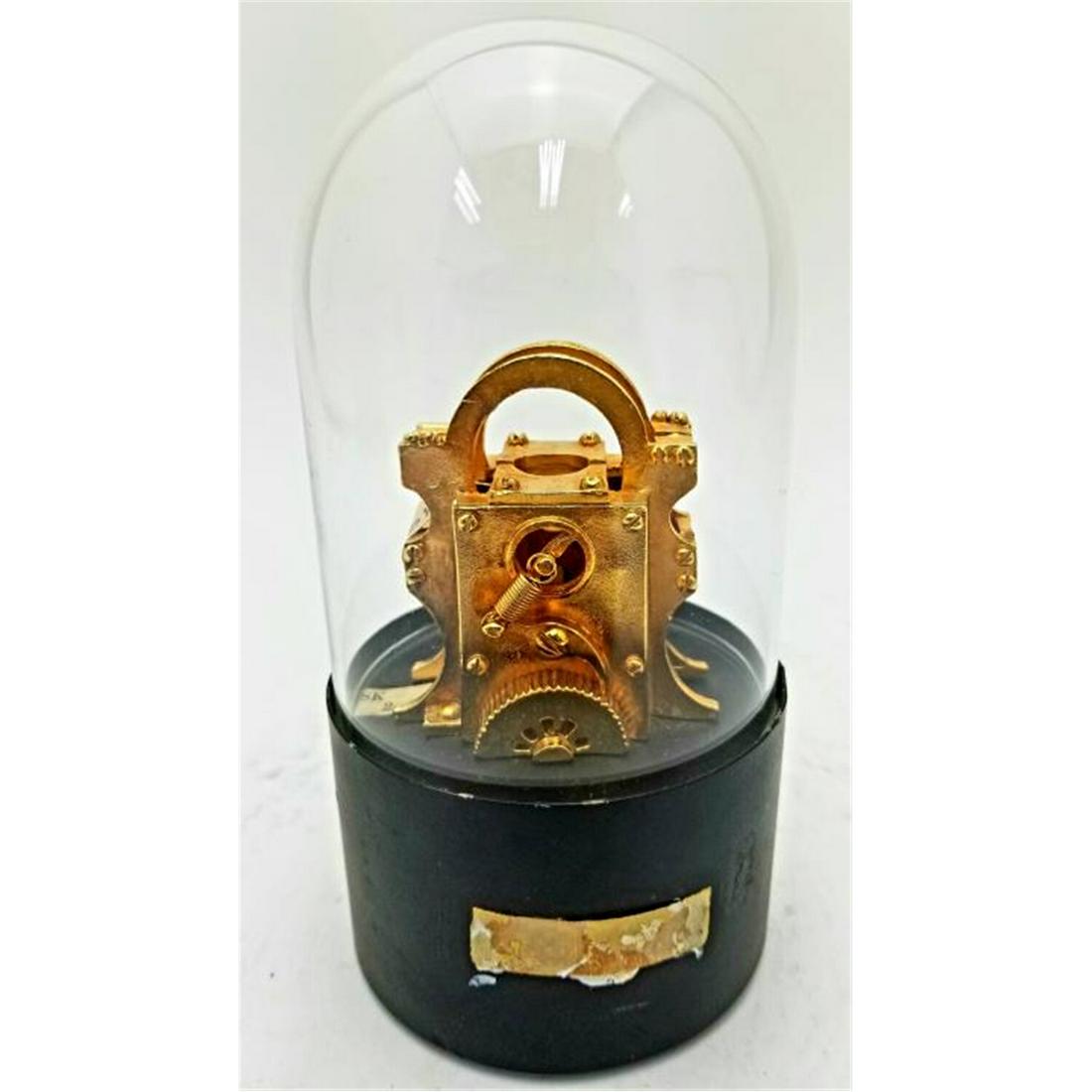 Old Wall Street Ticker Tape Machine Under Glass: Old Wall Street Ticker Tape Machine Under Glass Dome. Condition: Generally Very Good Condition. Dimensions: H- 5.75" Dia- 3". Provenance: From a Long Island, NY Home.Please note the absence of a condi