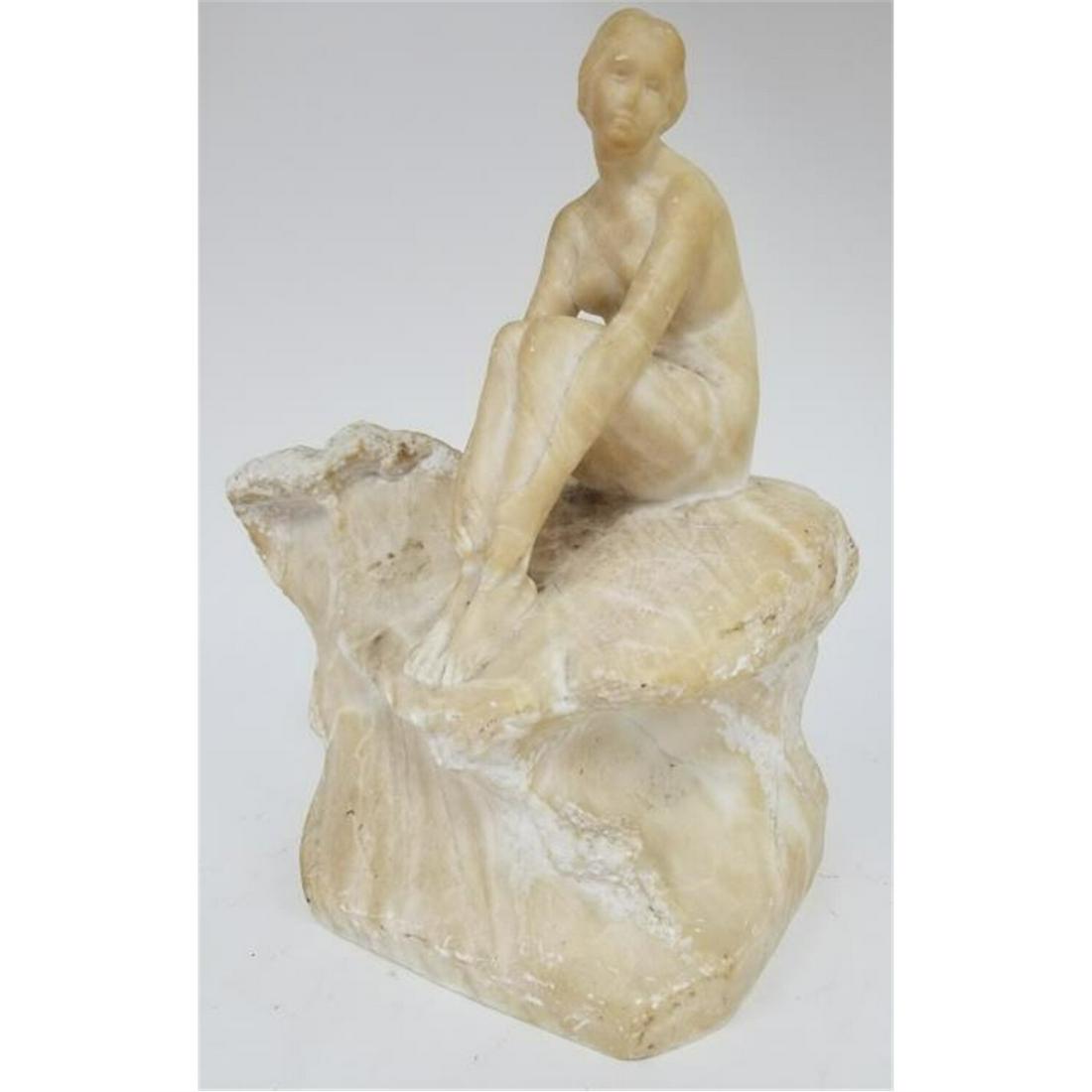 Antique Art Deco Alabaster Figure of a Nude Lady: Antique Art Deco Alabaster Figure of a Nude Lady Sitting on a Rock. Circa 1920s. Condition: Generally Good Condition with Very Minor Chips. Dimension: L-9" W-6" H- 12". Provenance: From a Long Island,