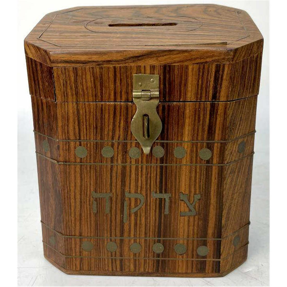 Judaica 1950's Wood Tzedakah Box with Inlaid Brass: Judaica 1950's Wood Tzedakah Box with Inlaid Brass. Condition: Generally Good. Dimensions: L: 5" x W: 3.25" x H: 5.9".Provenance: From an Upstate NY Home. Please note the absence of a condition report
