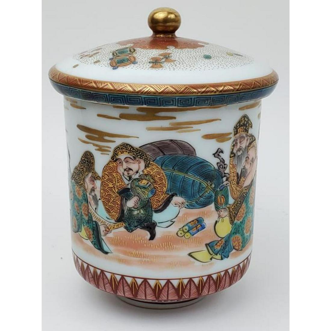 Japanese Satsuma Porcelain Tea Cup with Cover: Japanese Satsuma Porcelain Tea Cup with Cover. Signed on Bottom. Condition: Very Good, No Damage. Dimensions: Total H: 5.3" x Dia: 4". Provenance: From a Queens NY Collector. Please note the absence o