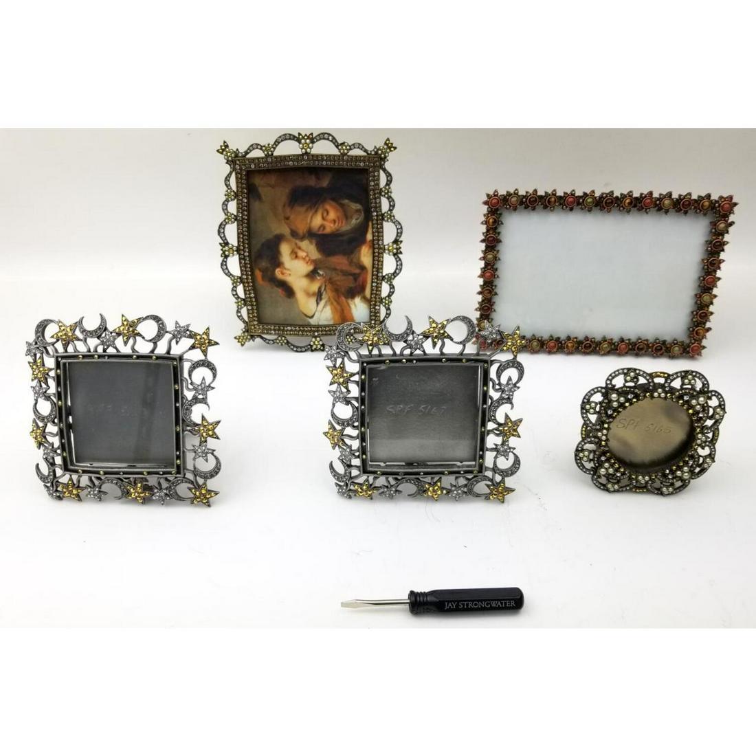 Lot of 5 Jay Strongwater Easel Back Picture Frames: Lot of 5 Jay Strongwater Easel Back Picture Frames. Various Sizes and Designs. With Original Jay Strongwater Screwdriver. All Signed. Condition: Generally Very Good. Dimensions: Largest- 6.5" x 4.75".