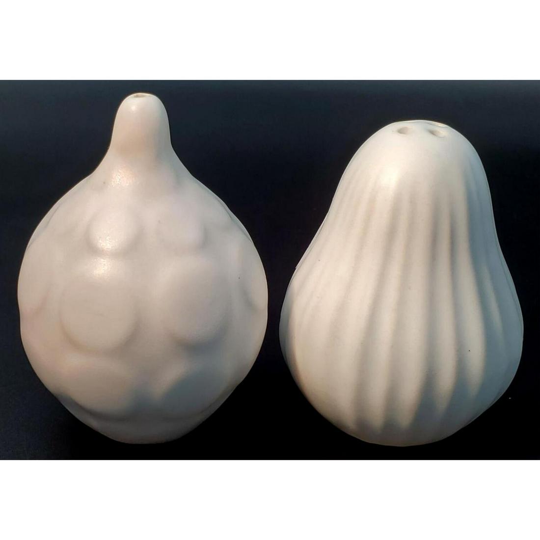 Jonathan Ader, Salt and Pepper Shakers: Jonathan Adler, American. White Salt and Pepper Shakers. Unsigned. Condition: Excellent. Dimensions: H- 3". Provenance: From a Long Island, NY Home. Please note the absence of a condition report does