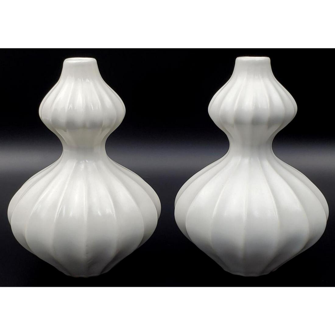 Jonathan Adler, Pair of White Vases: Jonathan Adler, American. Pair of White Vases. Fully Marked at the Bottom. Condition: Excellent. Dimensions: H- 5". Provenance: From a Long Island, NY Home. Please note the absence of a condition repo