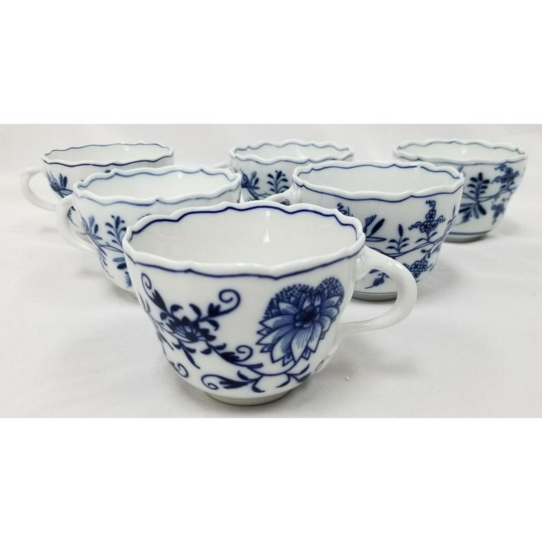 6 Meissen Porcelain Blue and White Cups: 6 Meissen Porcelain Blue and White Cups. Condition: Generally Good, No Chips or Cracks. Dimensions: H- 2.5", Dia- 3.5". Provenance: From a Queens, NY Home. Please note the absence of a condition repor