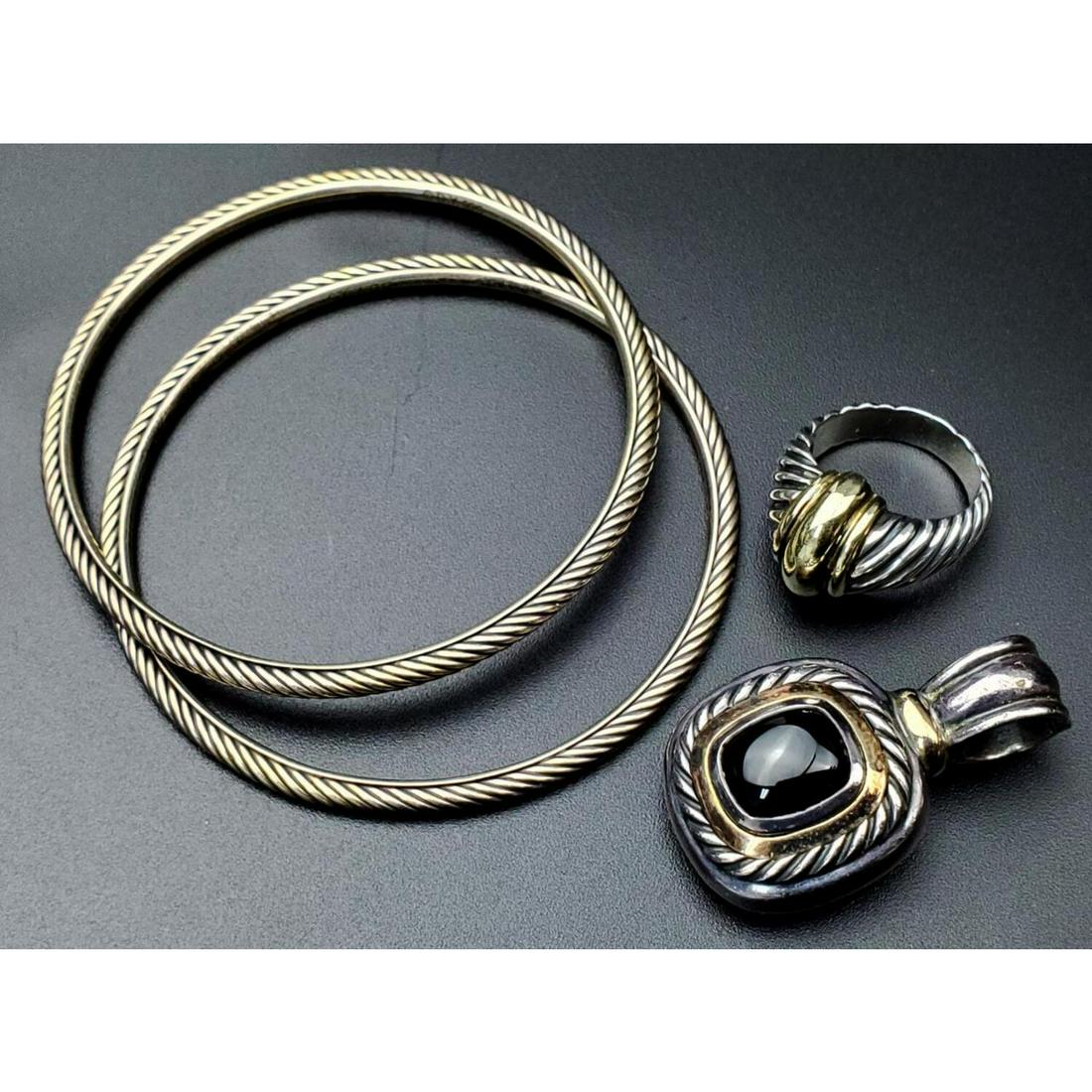 4 pcs David Yurman Sterling Silver /14K Gold Items: 4 Piece David Yurman Sterling Silver and 14K Gold Items Including 2 Bracelets, 1 Ring, and 1 Pendant. All Fully Hallmarked. Condition: Excellent. Dimensions: Bracelet Dia- 2.5", Ring Size- 6.25". Weig