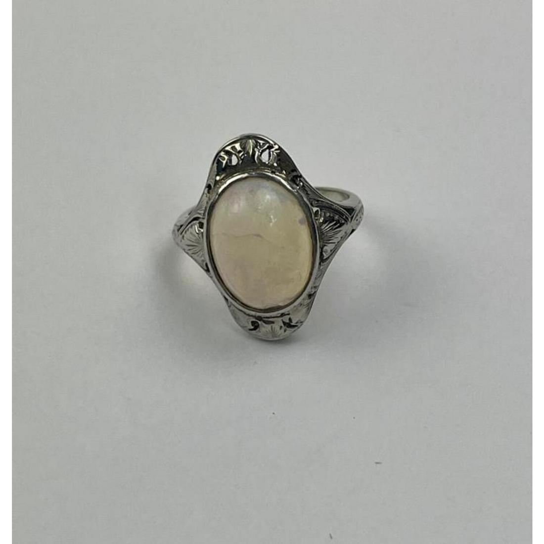 18K White Gold & Opal Ladies Ring.: 18K White Gold & Opal Ladies Ring.Condition: Generally Good.Dimensions: Ring Size 2.7Total Weight: 3.5g/2.3dwt.Provenance: From a Long Island, NY Home.Please note the absence of a condition report doe