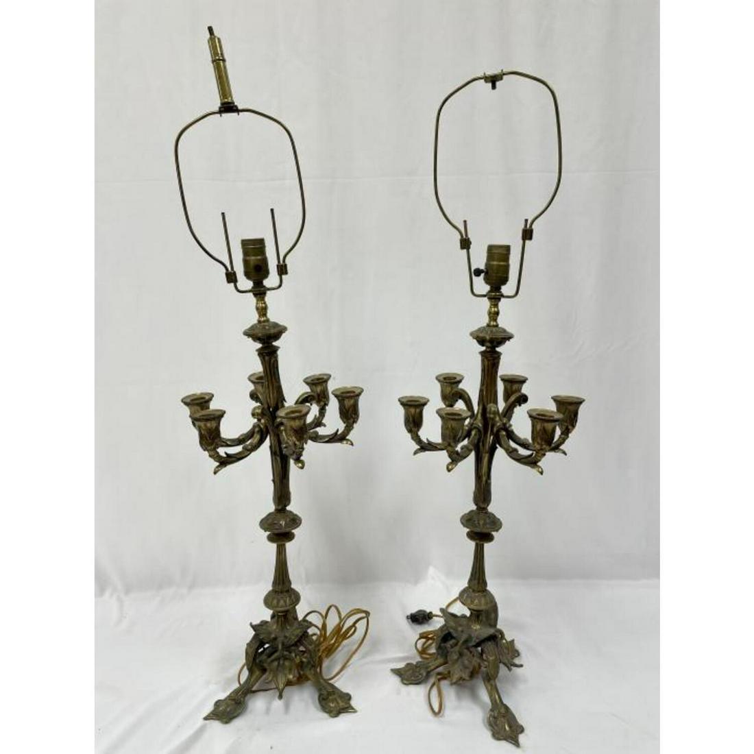 Pair Vintage Ornate 7 Light Brass Candelabra Lamps: Pair of Vintage Ornate 7 Light Brass Candelabra Made into Lamps. Condition: Generally Good. Dimensions: H- 23", Dia- 11". Provenance: From a Long Island, NY Home. Please note the absence of a conditio