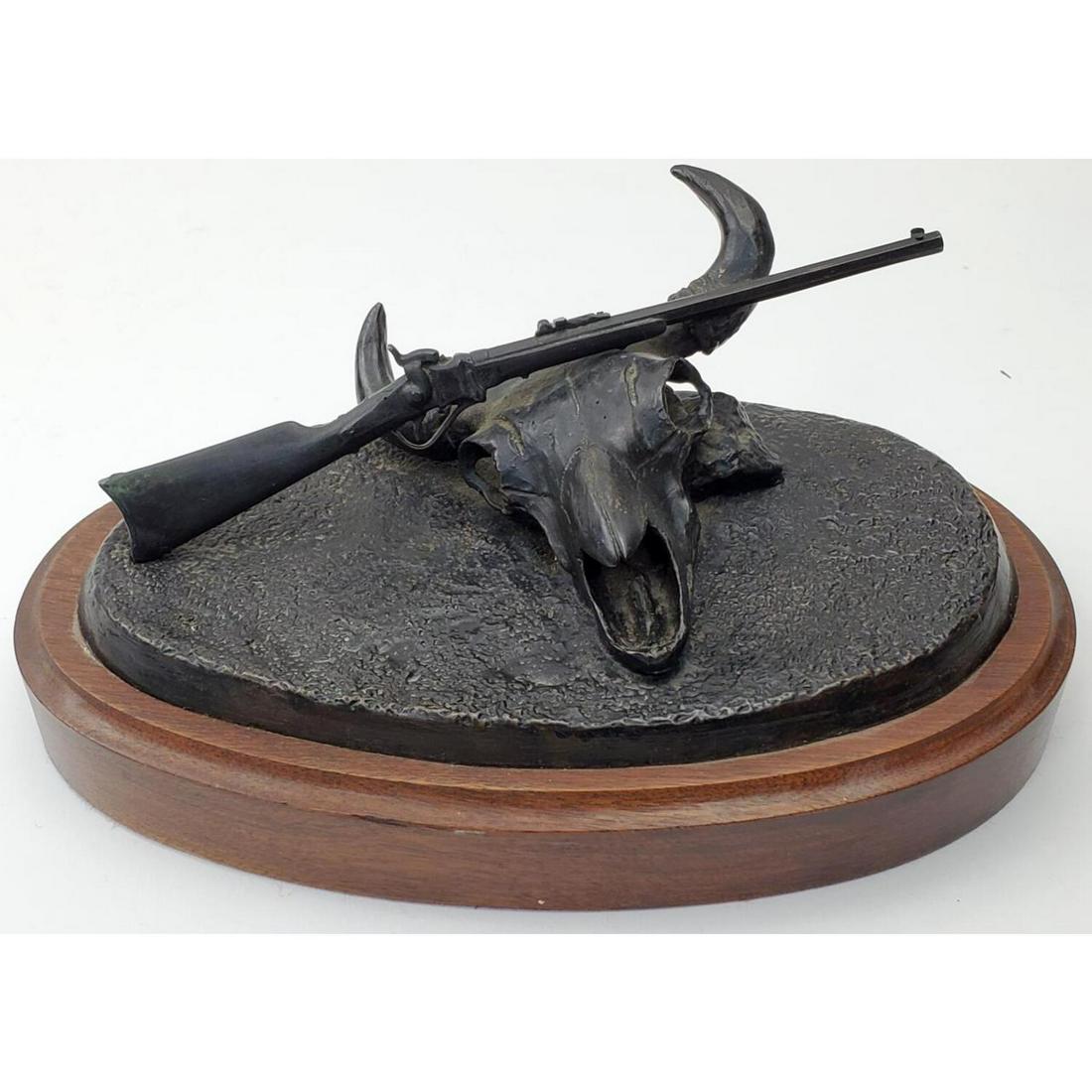 Carl Pugliese, Bronze Figure "SHARPS BIG FIFTY": Carl Pugliese, American (1918-1982). Bronze Figure "SHARPS BIG FIFTY". Fully Signed, Numbered, and Dated 1950. Mounted on Original Wood Base. Condition: Excellent. Dimensions: Base L- 8.5", W- 5.25". 