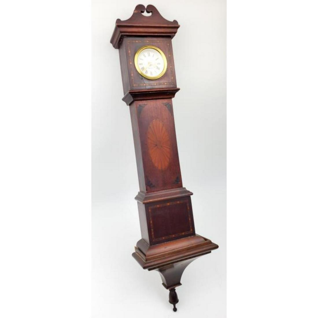 Miniature English Style Grandfather Clock: Miniature English Style Grandfather Clock w/ Wall Bracket w/ Inlaid Wood. Signed.Condition: Generally Good w/ Couple of Repairs on the Top & The Movement is Probably Not Original.Dimensions: H-17.5" x