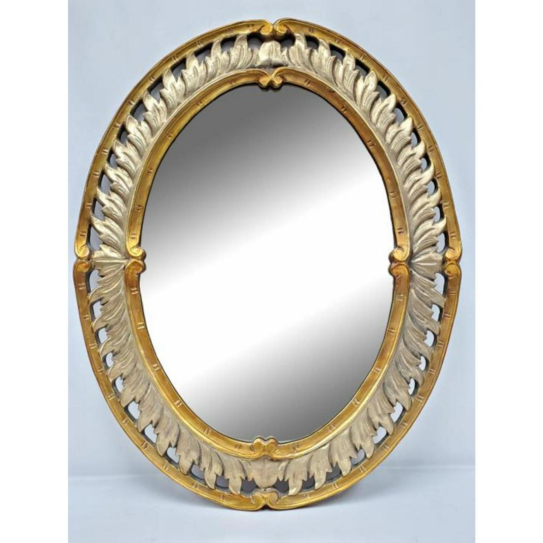 MCM Carved Wood Oval Wall Hanging Mirror: MCM Carved Wood Oval Wall Hanging Mirror. Condition: Generally Very Good. Dimensions: Mirror- 26.25" x 18.75" Frame- 35.75" x 28.25". Provenance: From a Long Island, NY Home. Please note the absence o