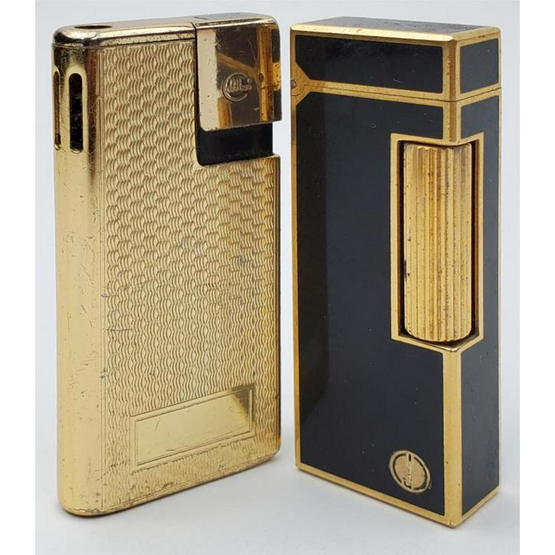 Vintage Dunhill Swiss Made Enameled Lighter: Vintage Dunhill Swiss Made Enameled Lighter Along w/ Colibri of London Lighter.Condition: Both Generally Good, Used.Dimensions: H-2.5" Each.Provenance: From a Long Island, NY Home.Please note the abse