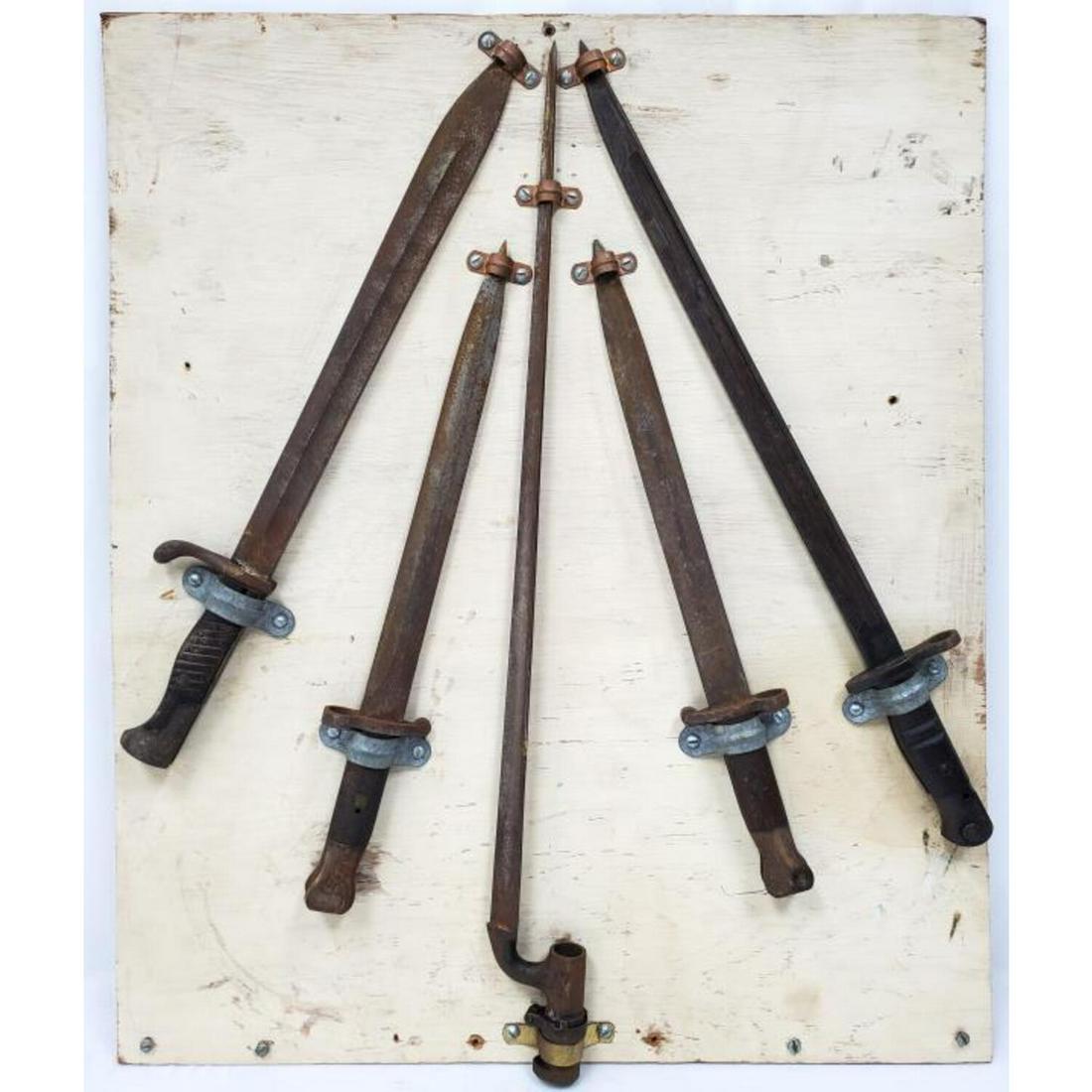 5 Antique & Vintage Daggers & Rifle Sword: 5 Antique & Vintage Daggers & Rifle Sword Displayed on Wood.Condition: Generally Good As FoundDimensions: Longest-L-25". Wood-26" x 22".Provenance: From a Long Island, NY Private Collector.Please note
