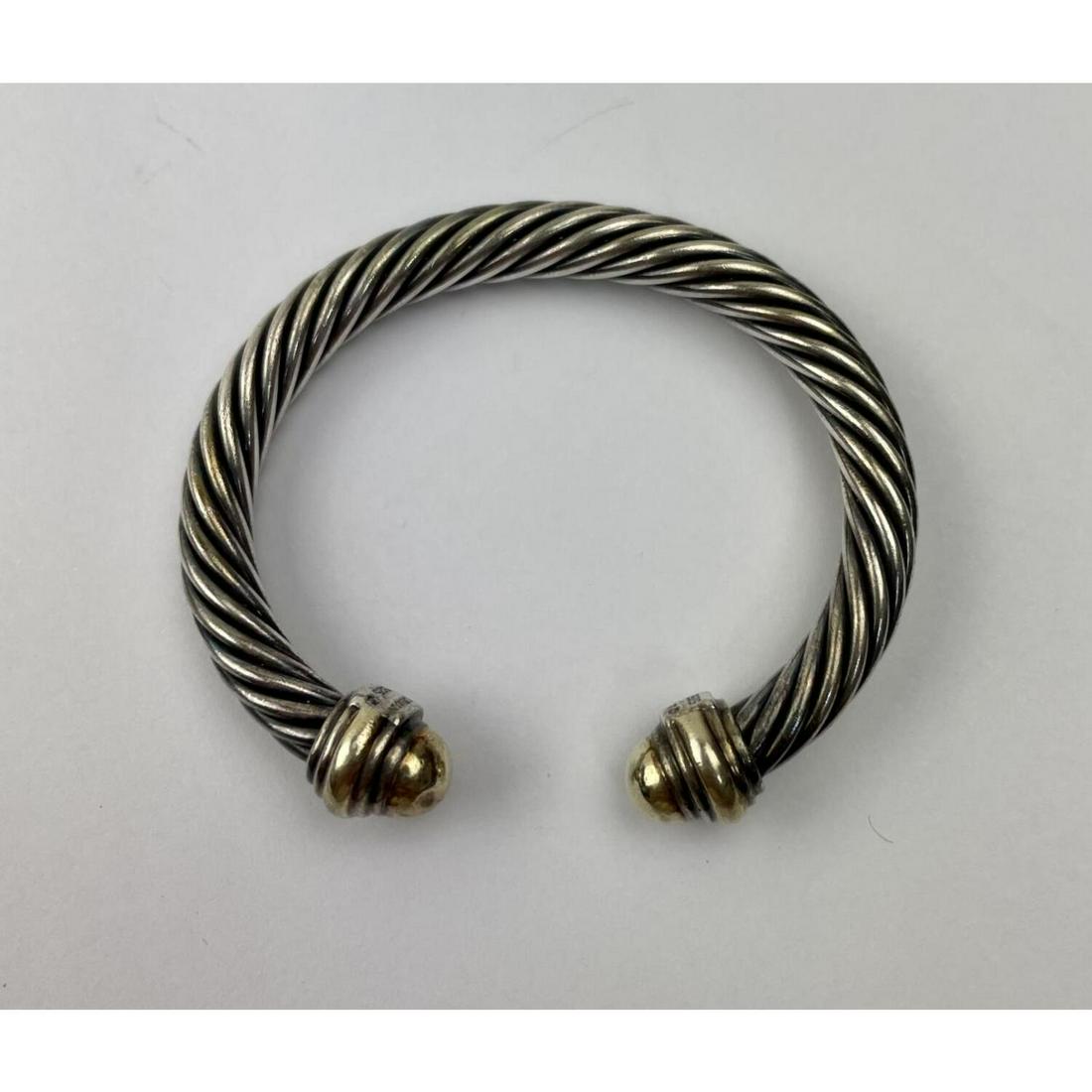 David Yurman 14K Gold and Silver Cable Bracelet: David Yurman 14K Gold and Silver Cable Bracelet. signedCondition: Generally Good with very Small DentsDimensions: Inner Dia 2", Outer Dia 2.75"Weight: 44.7 g. Provenance: From a Queens, NY Home. Pleas