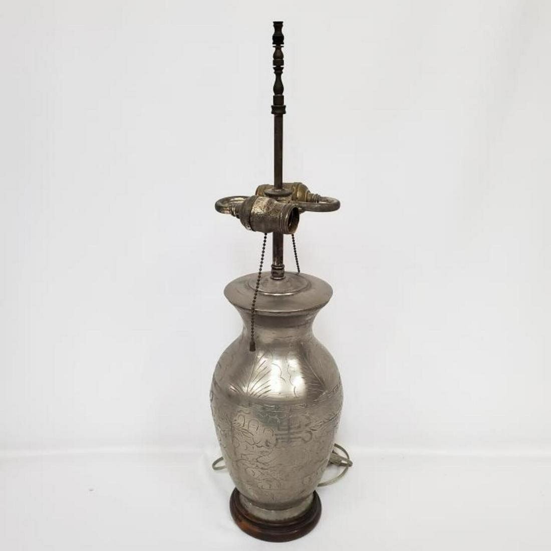 Antique Chinese Metal Lamp with Carvings: Antique Chinese Metal Lamp with Carvings on Original Wood Base. Condition: Generally Very Good. Dimension: H- 24". Provenance: From a Long Island, Ny Home. Please note the absence of a condition repor